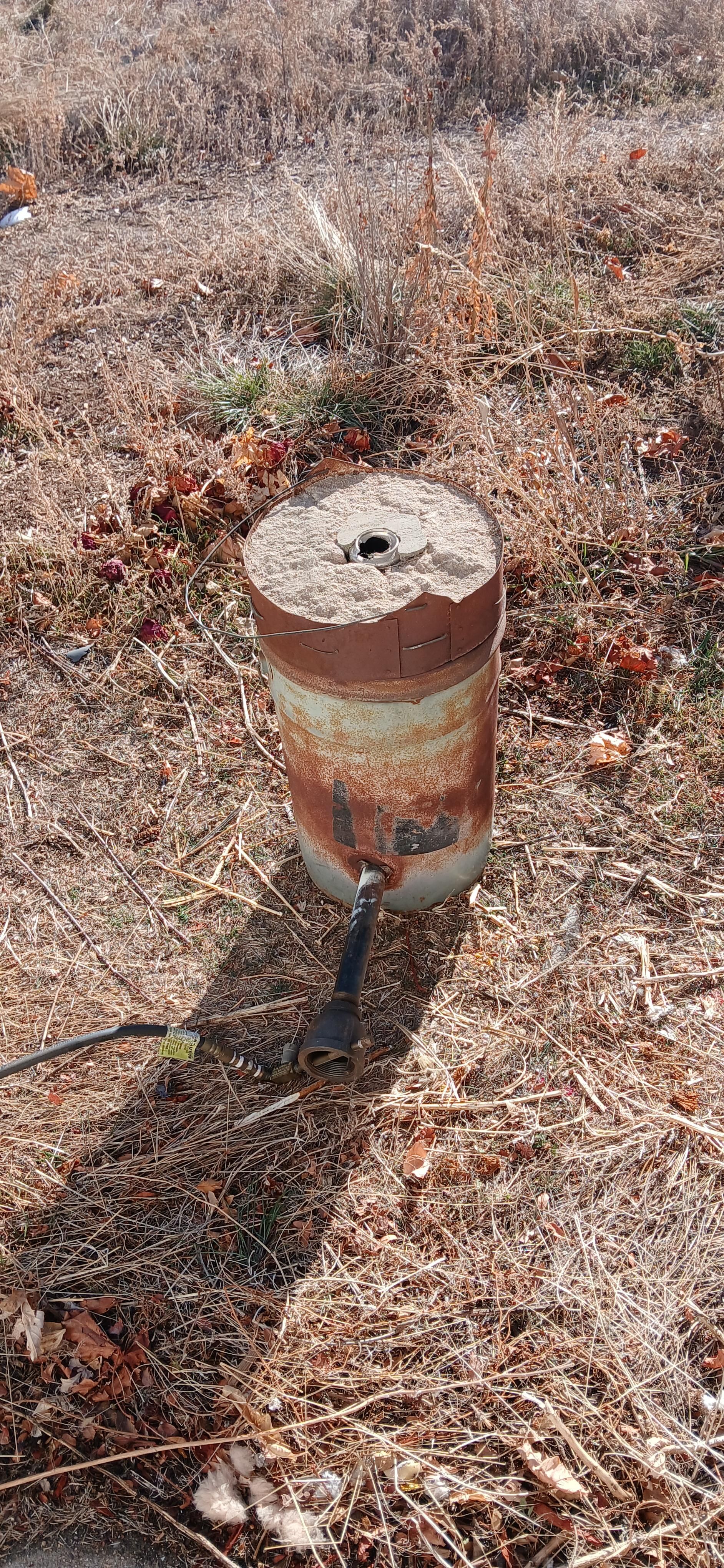 Metal bucket lined with refractory clay
