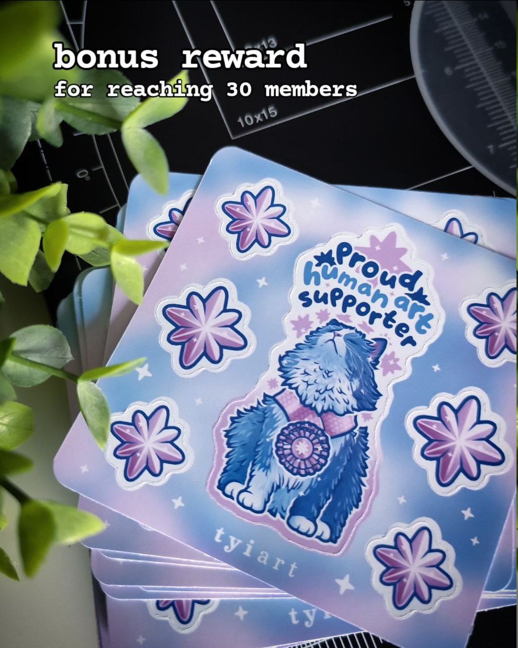 Photo of a bonus rewards which is a square sticker sheet with 6 star stickers and a proud kitty sticker titled "proud human art supporter"