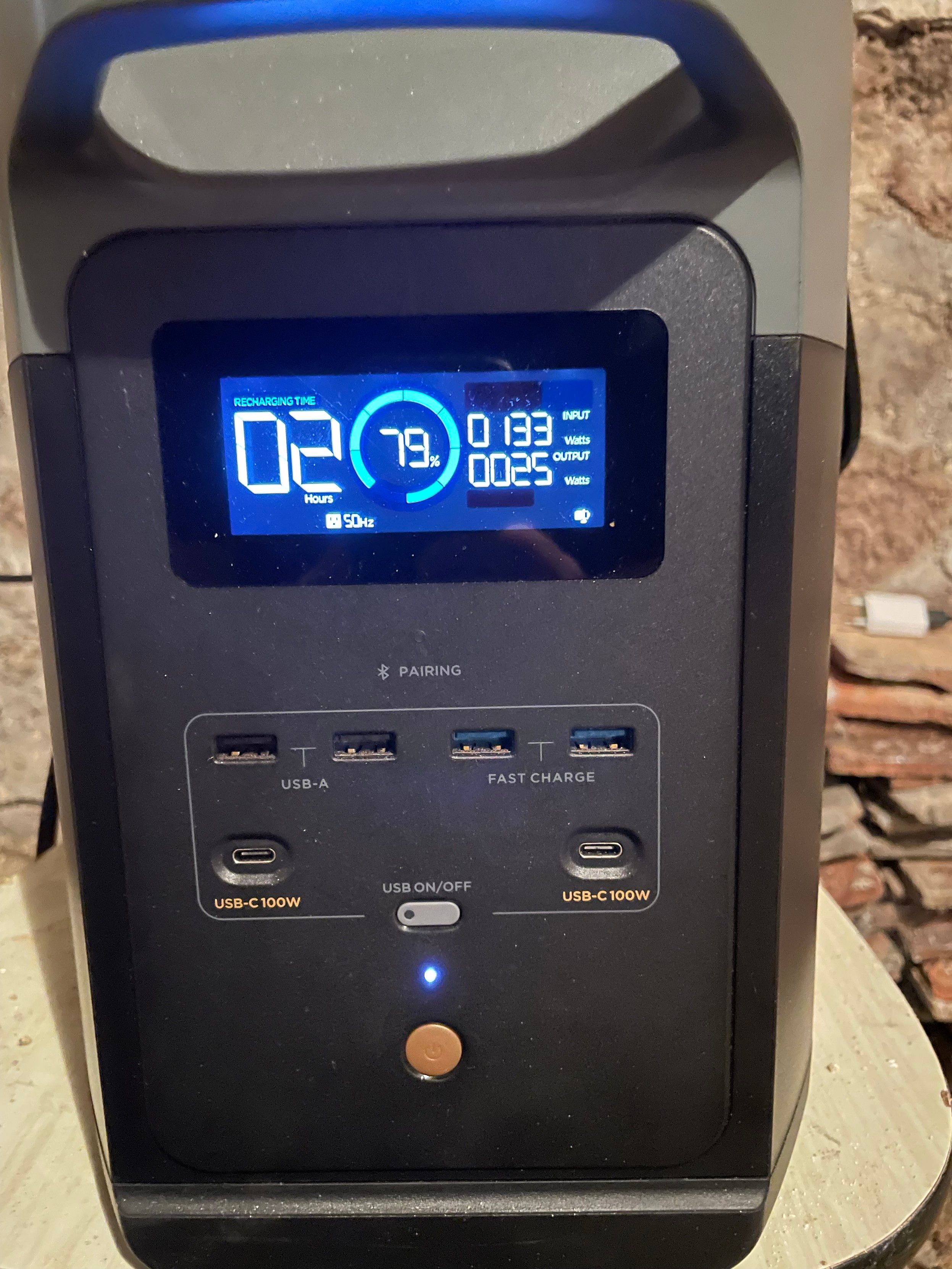 Photo of my solar charged battery, taken at noon
The display is citing numbers:
79% charge
133 W input
25 W output
2 hours until full charge