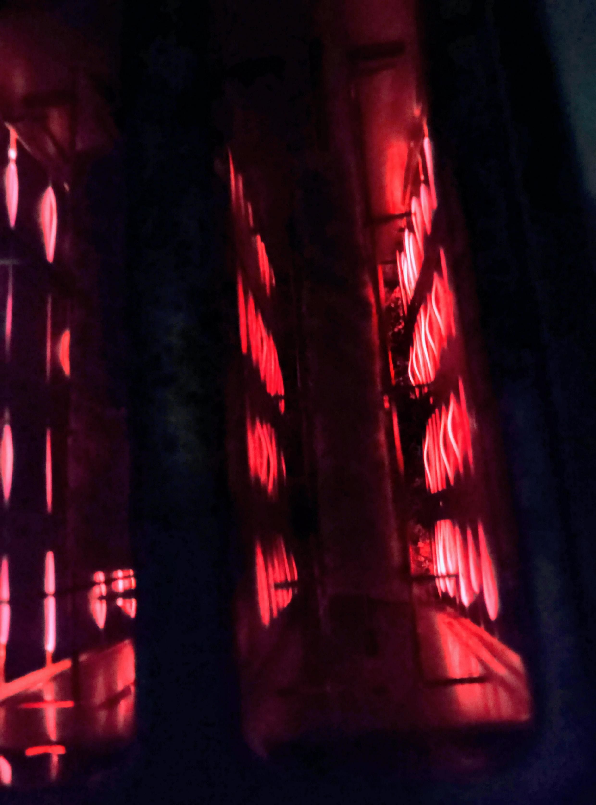 Filaments glow as toast toasts in the toaster, round side down. 