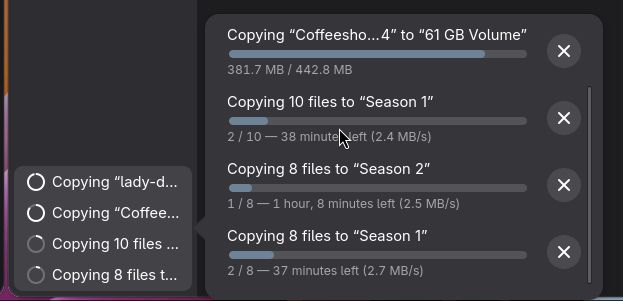 At least 4-5 copy operations happening in Gnome's file manager, all at various stages of progress. 