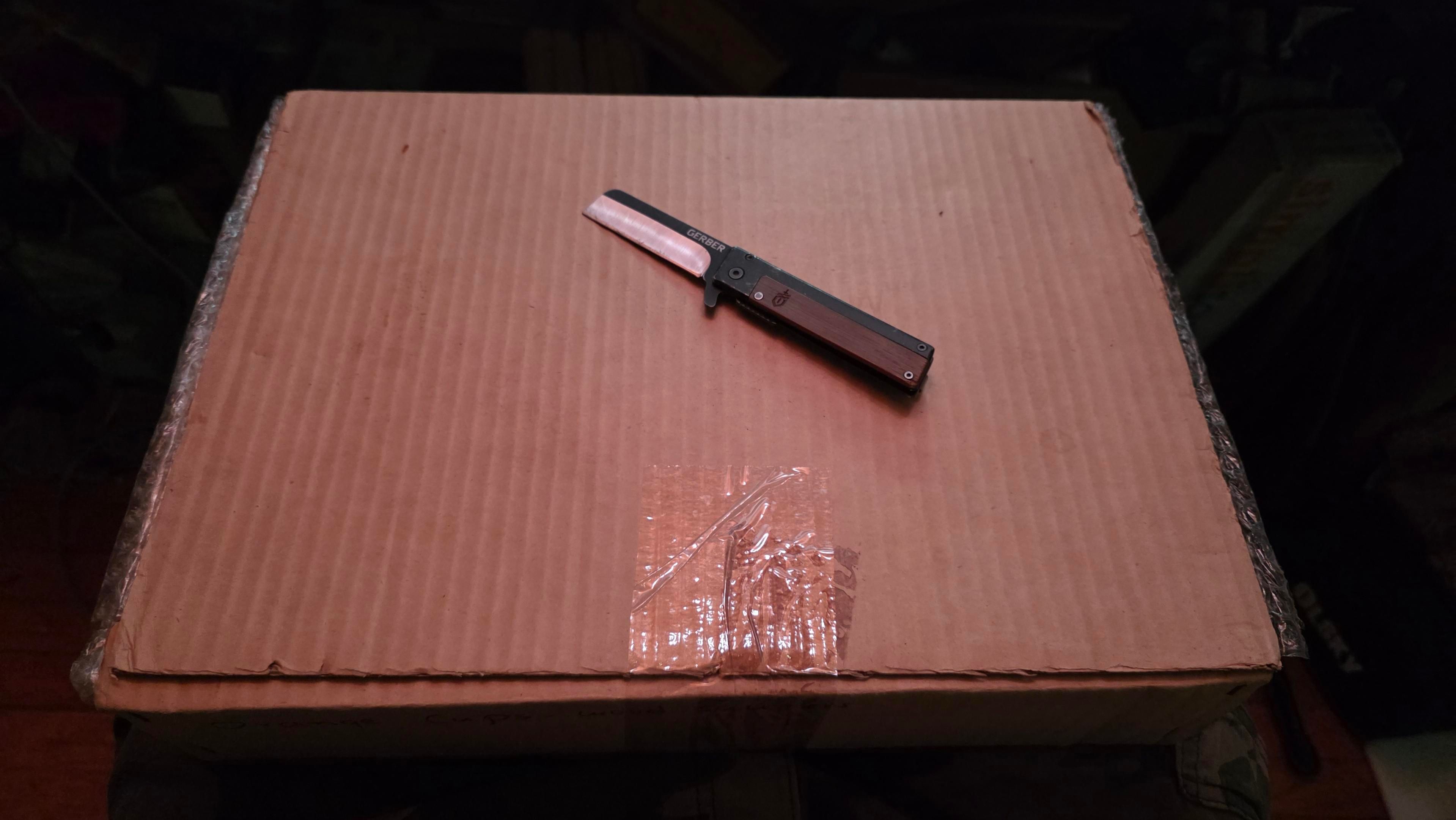 A box that came out of the previous box, with my pocket knife laying on top