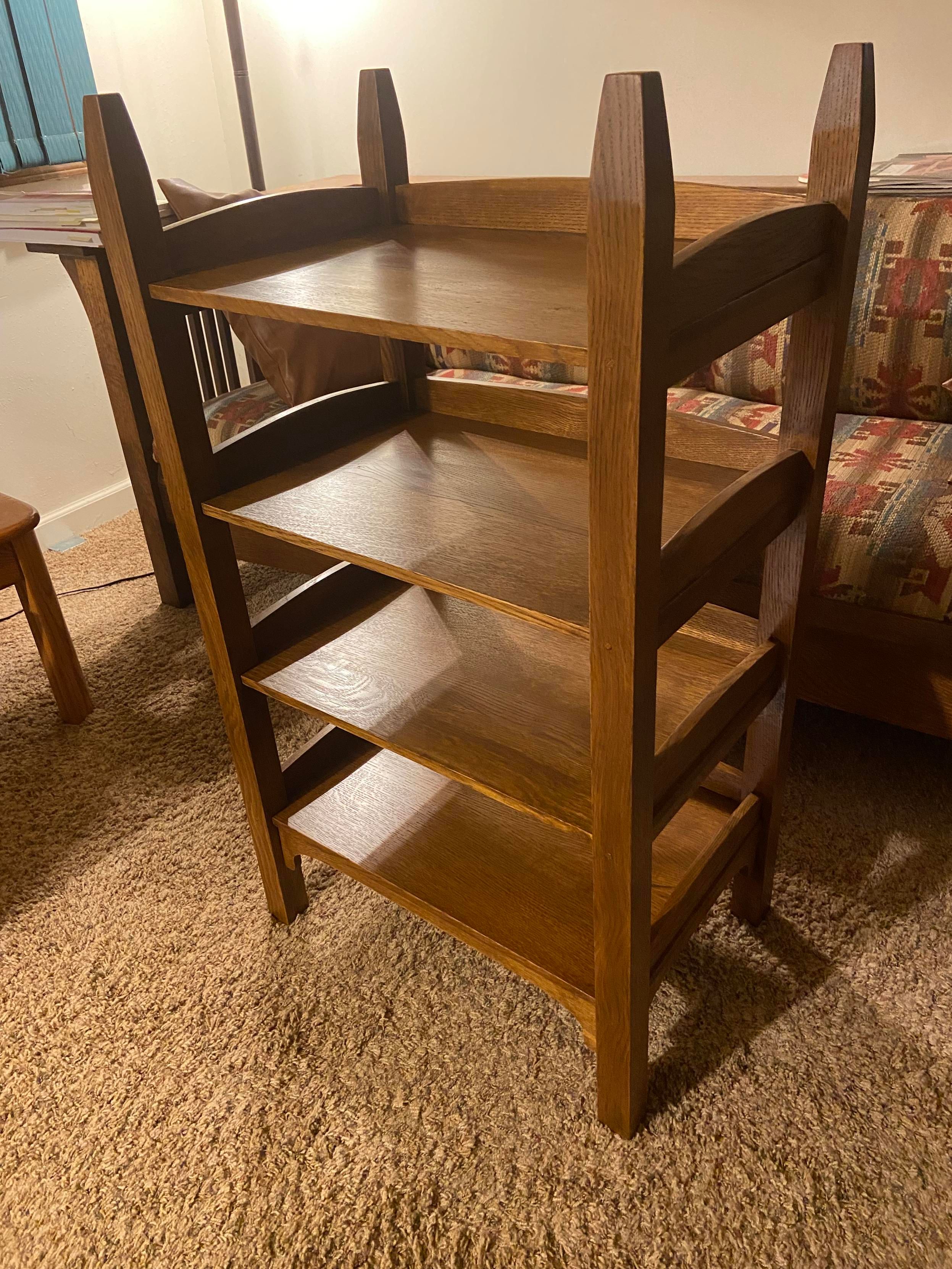 My reproduction of a circa-1910 Gustav Stickley No. 670 Music Rack (shelves).  Material is quarter-sawn white oak.  Joinery is mortise-and-tenon with dowel pins.  (No metal fasteners.)

The shelves are fixed at the front and are free to float between the rails as humidity varies.

Finish is Trans-Tint Dark Vintage Maple dye-stain (1/4-oz dye in 8-oz distilled water), then General Finishing (GF) Seal-A-Cell, then GF Antique Walnut gel-stain as a glaze, and GF Arm-R-Seal Oil & Urethane (2 coats on most pieces, 3 coats on the shelves).