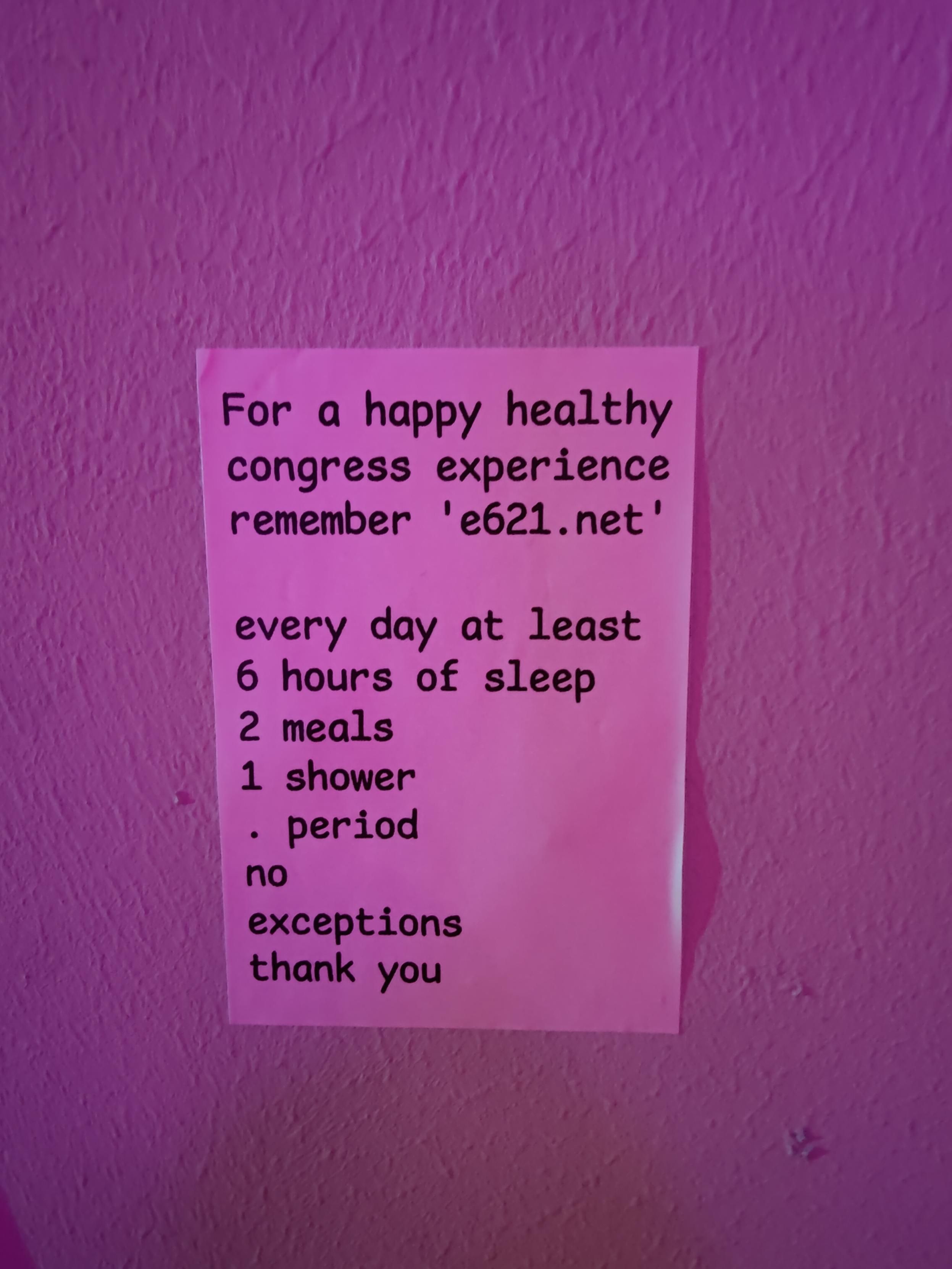 A sticker saying "For a happy healthy congress experience remember e621.net

every day at least
6 hours of sleep
2 meals
1 shower
period
no
exceptions 
thank you"