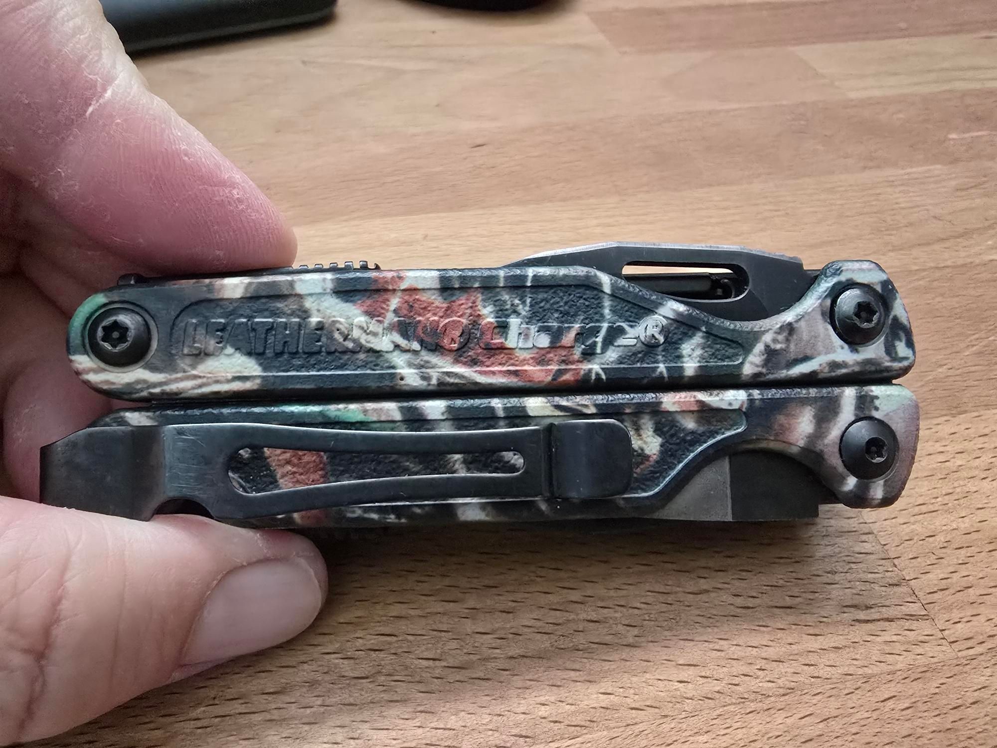 A Leatherman Charge TTi camo clip side.