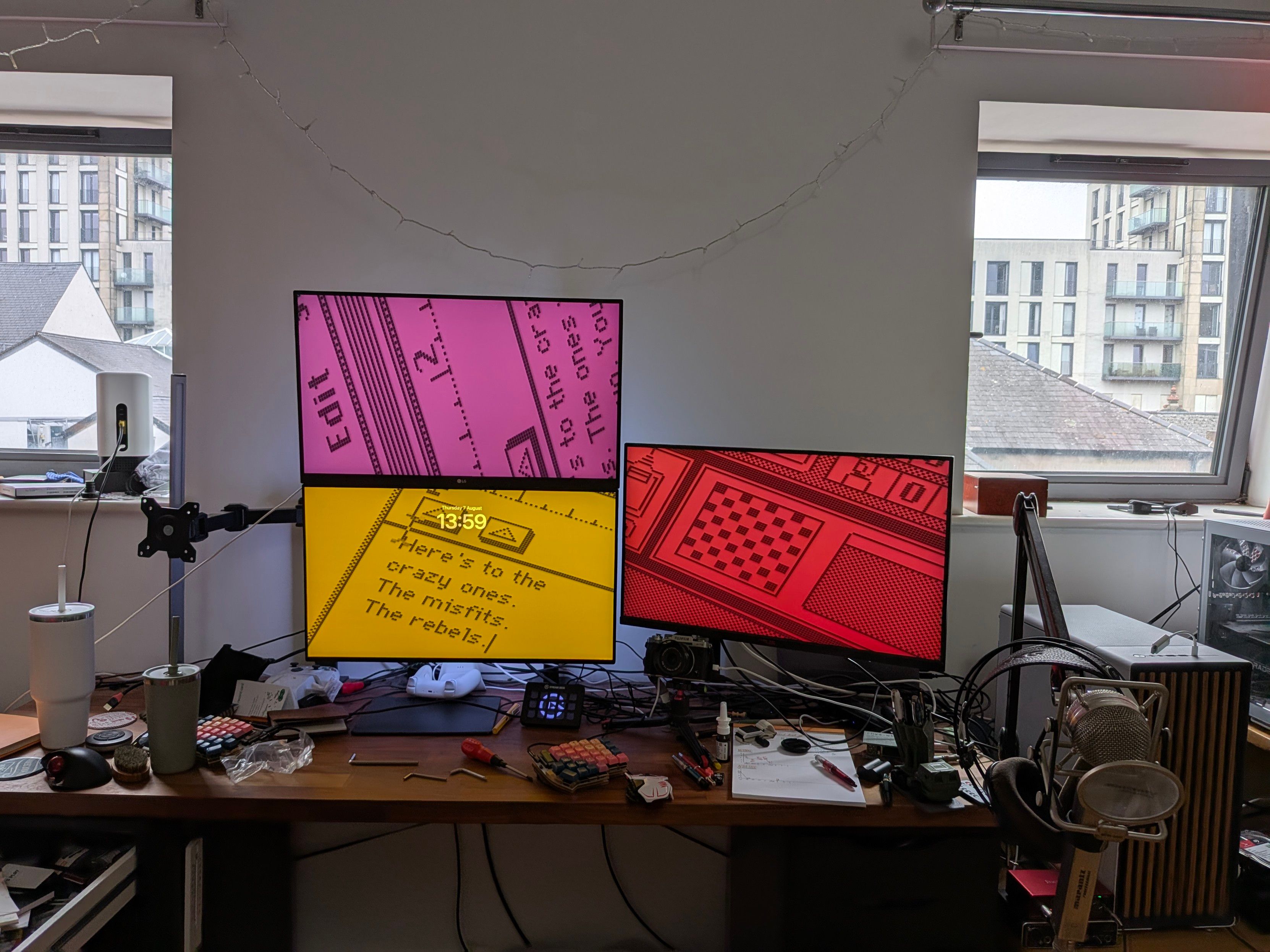 The same desk setup but the left monitor is now horizontal and positioned above the centre one.  The right one is in the same position, above the bottom monitor but not centred vertically.