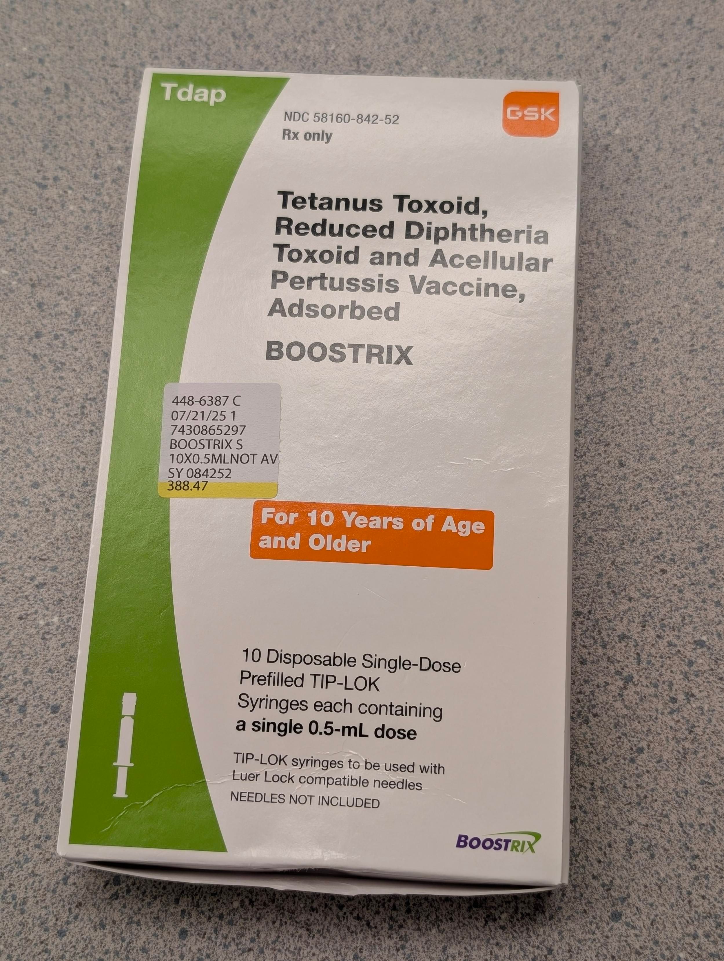 box containing doses of the vaccine lying on a counter.