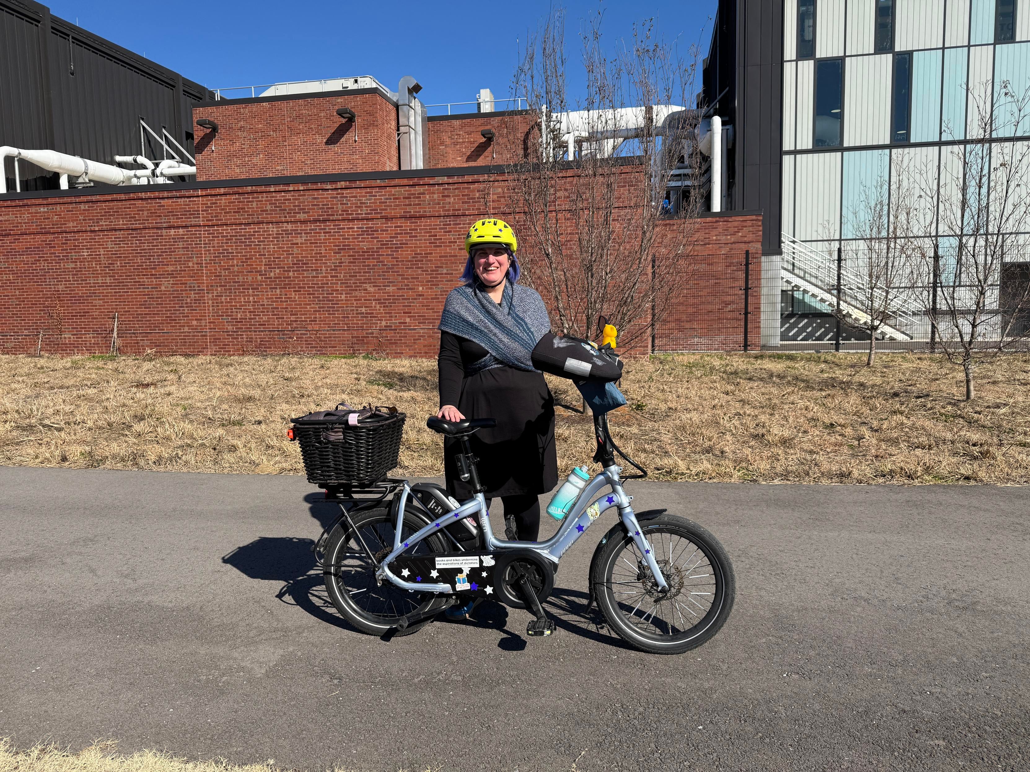 Person standing next to a bike