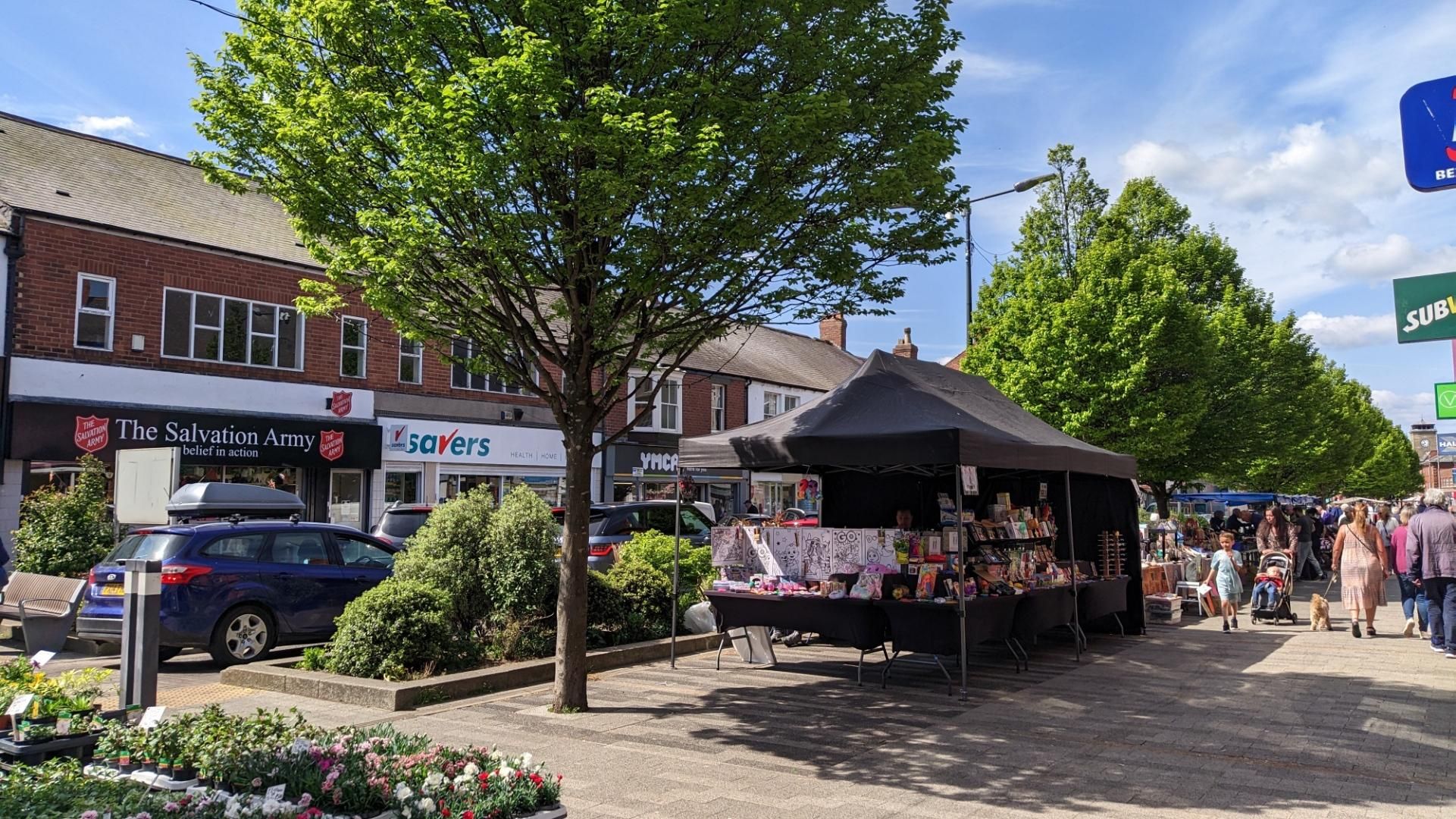 Busy street, trees, street shops