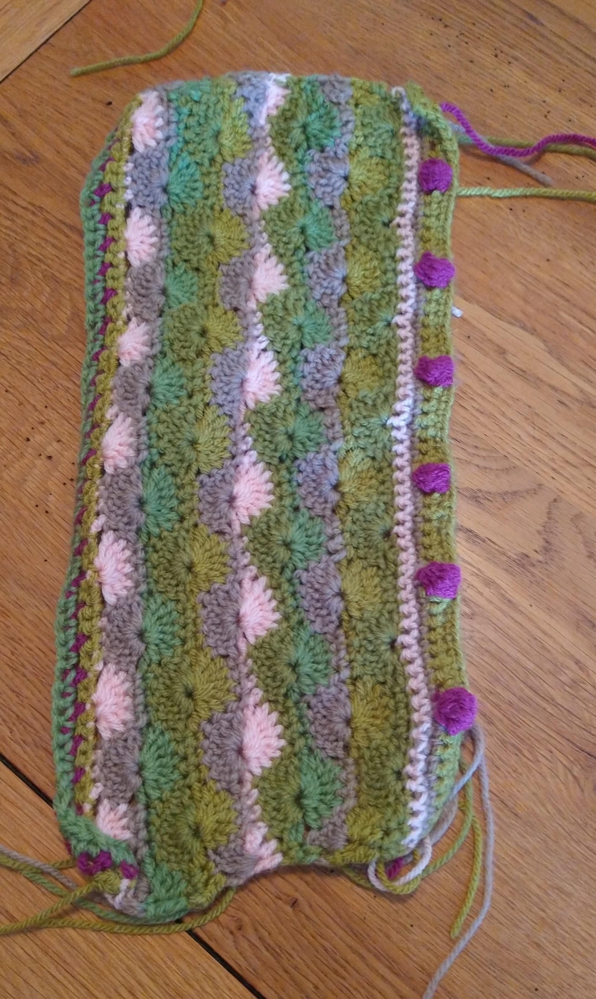 Rectangular crochet piece in pinks green and beige 