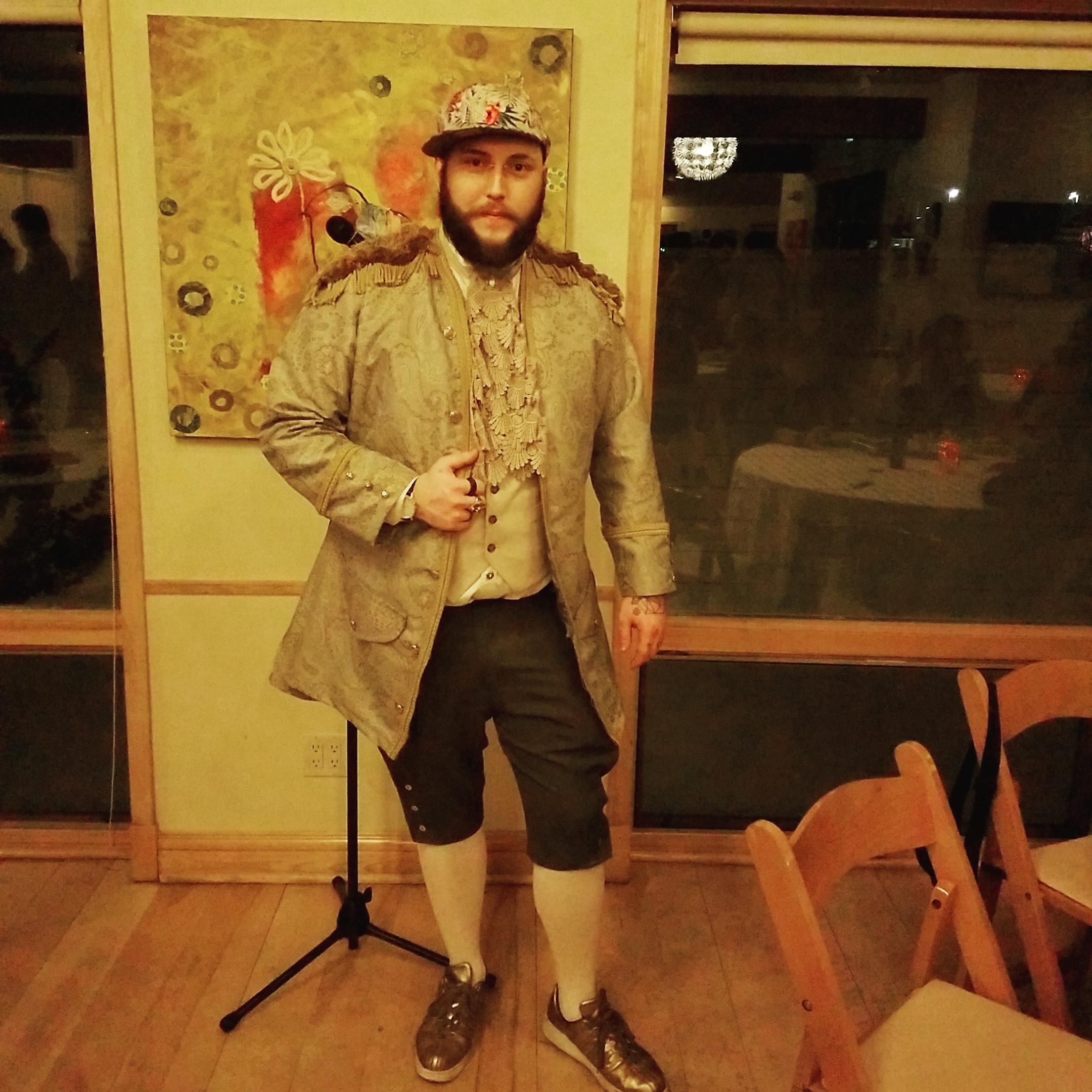 Fit check: Floral fitted cap, rococo jacket, lace jabot, vest, short breeches, white stockings, gold sneakers. 