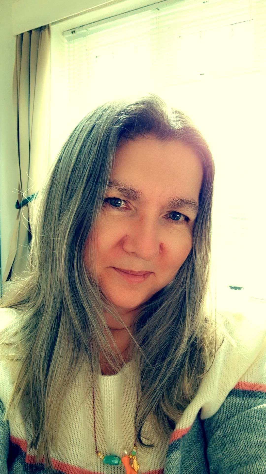 Me. The boring white woman previously mentioned. I have long straight greying hair, parted in the middle, no fringe, and i think i look kind