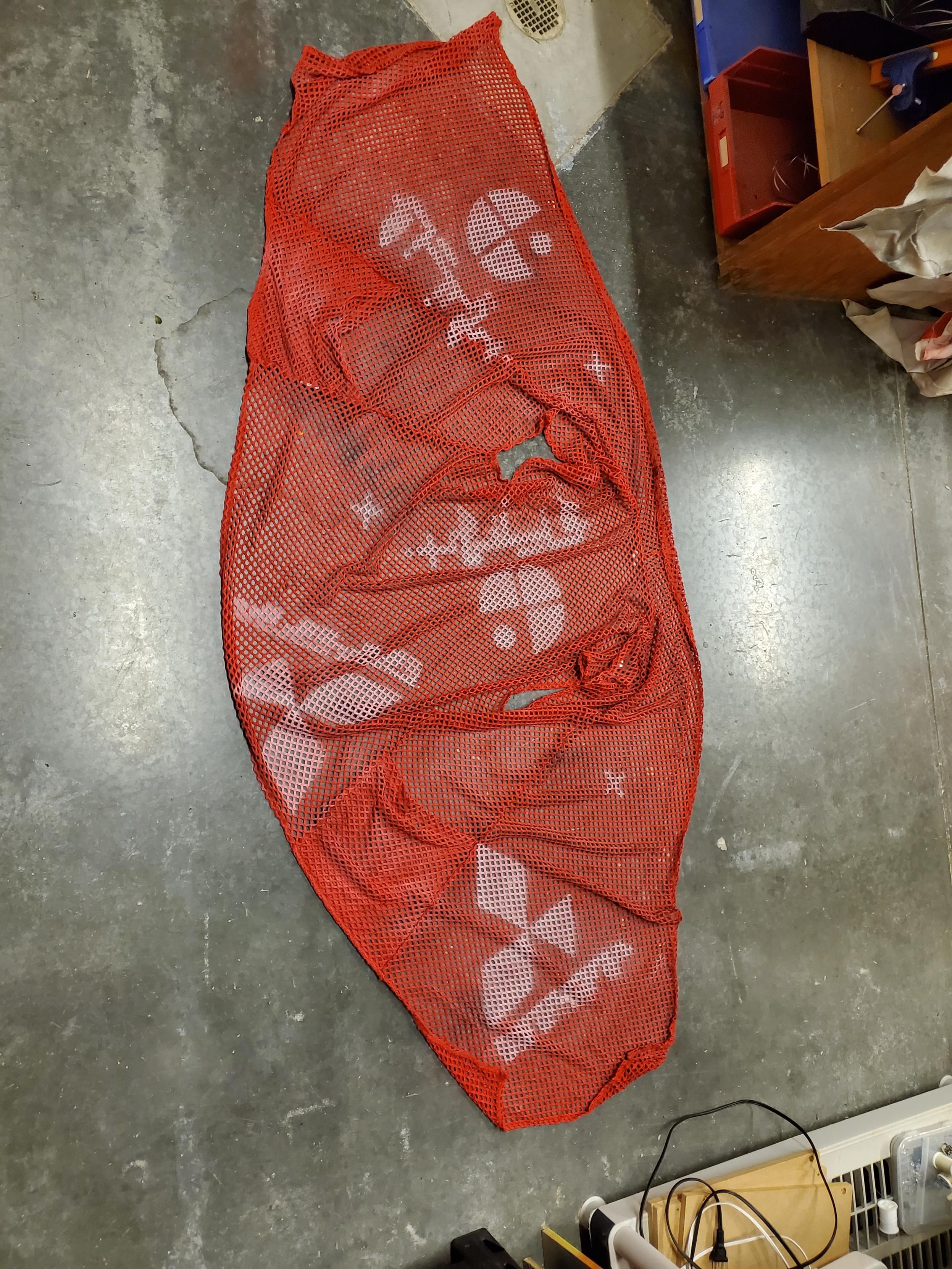 Red fishnet vest with pockets and logo print