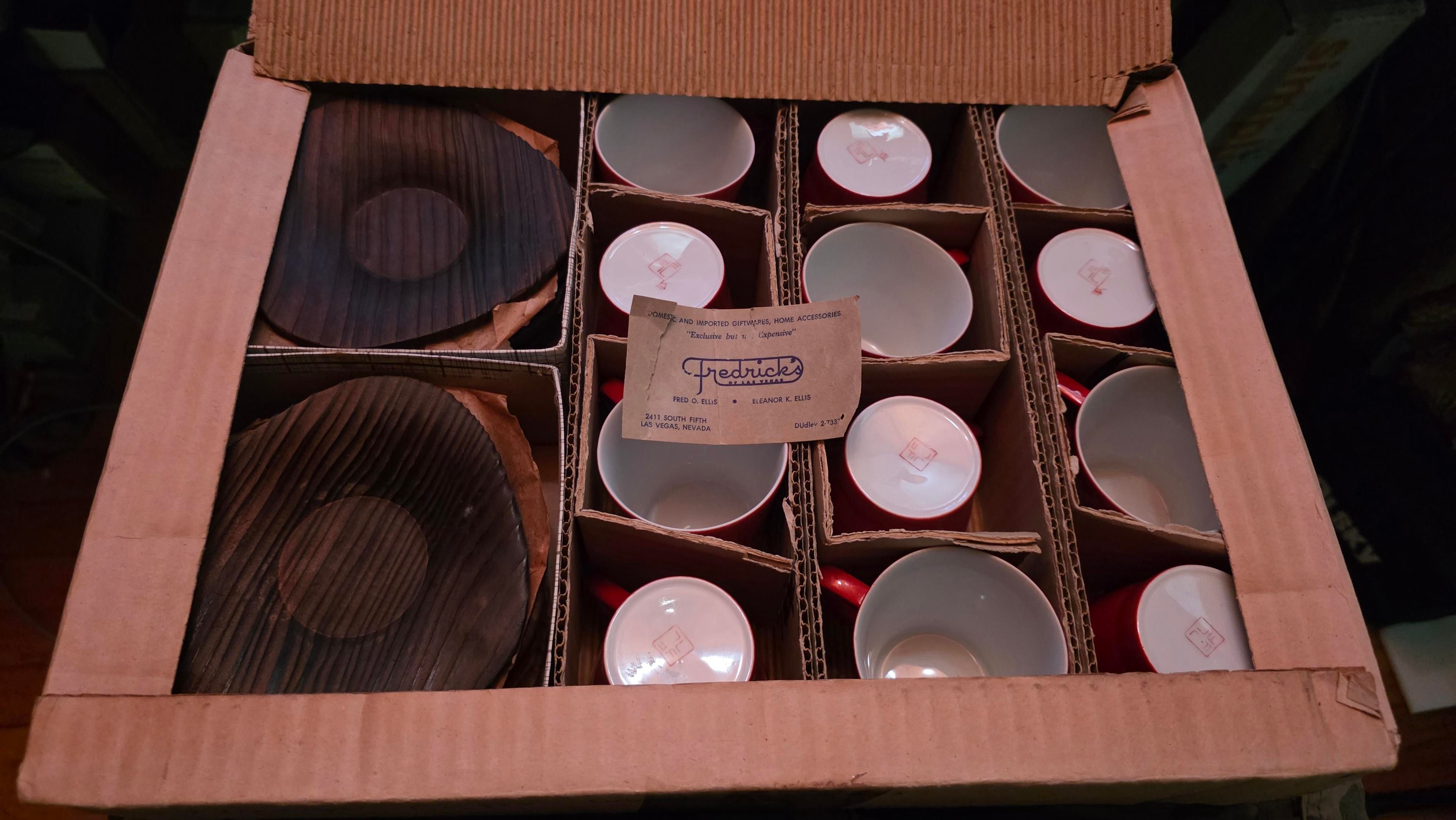 The inner box opened, displaying a set of 12 orange demitasse cups and 12 Japanese cedar saucers