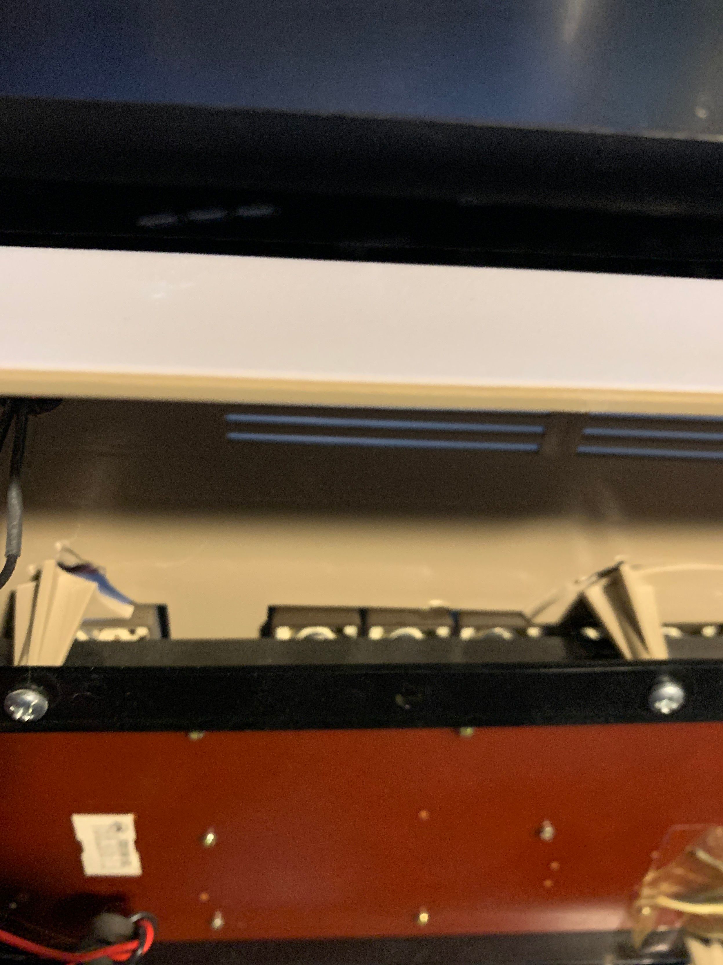 Inside view of the broken alley board screw mounts. Right most is fully separated (around the function keys). The next screw mount is only cracked.