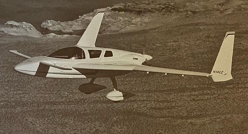 Grayscale image of a Cozy MK IV in flight