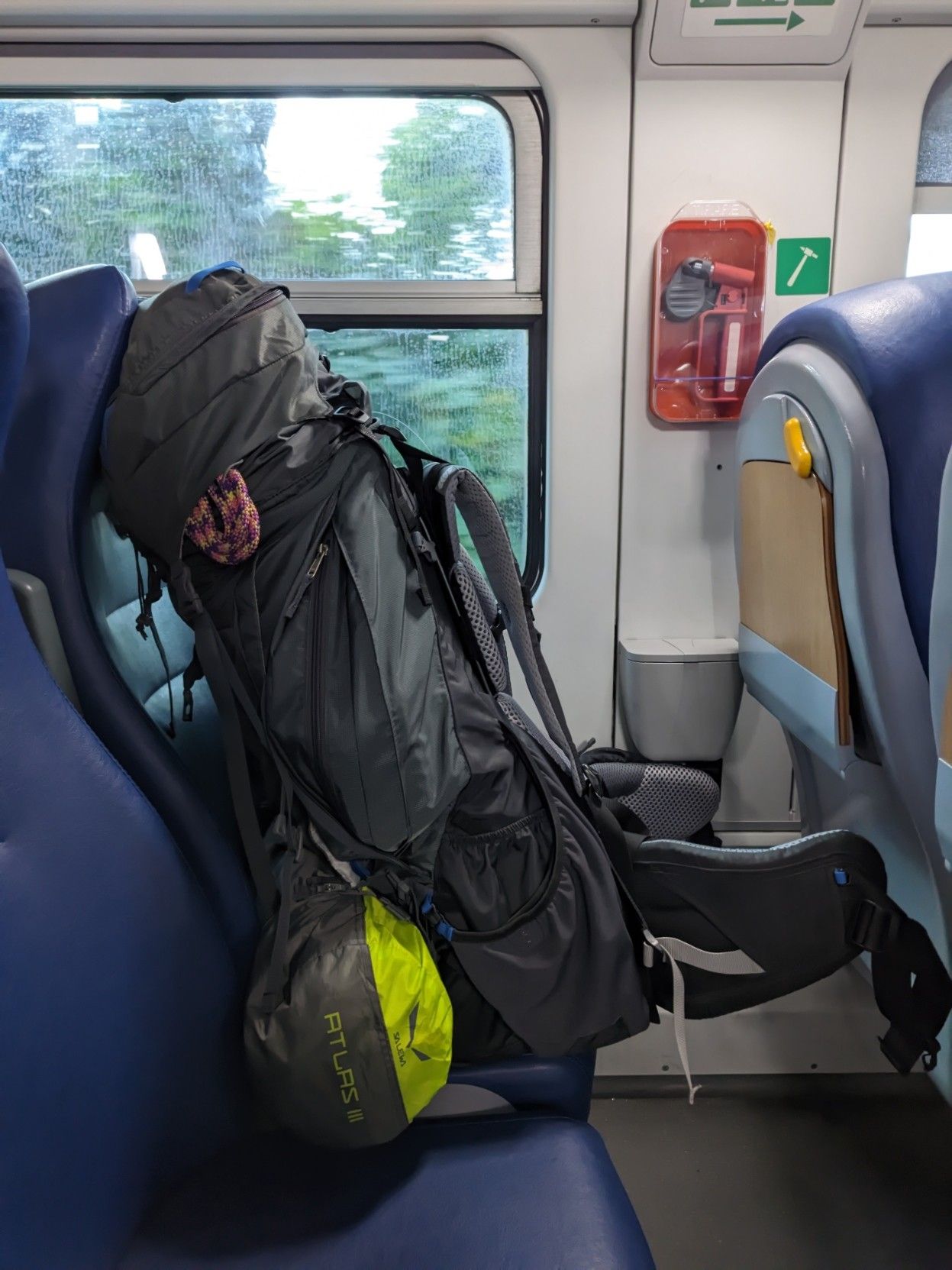 Photo of my huge backpack, filling the space of a whole train seat.