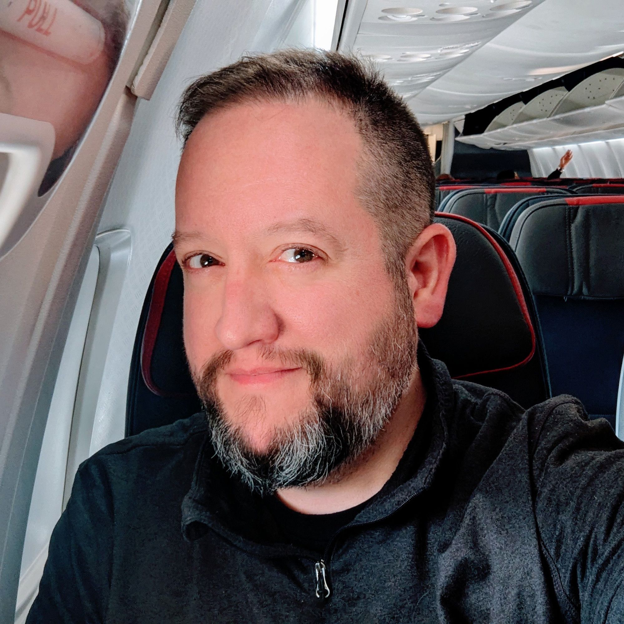 Selfie of me in my happy place... an airplane window seat (I do generally prefer the port side of the aircraft, but starboard will do in a pinch)