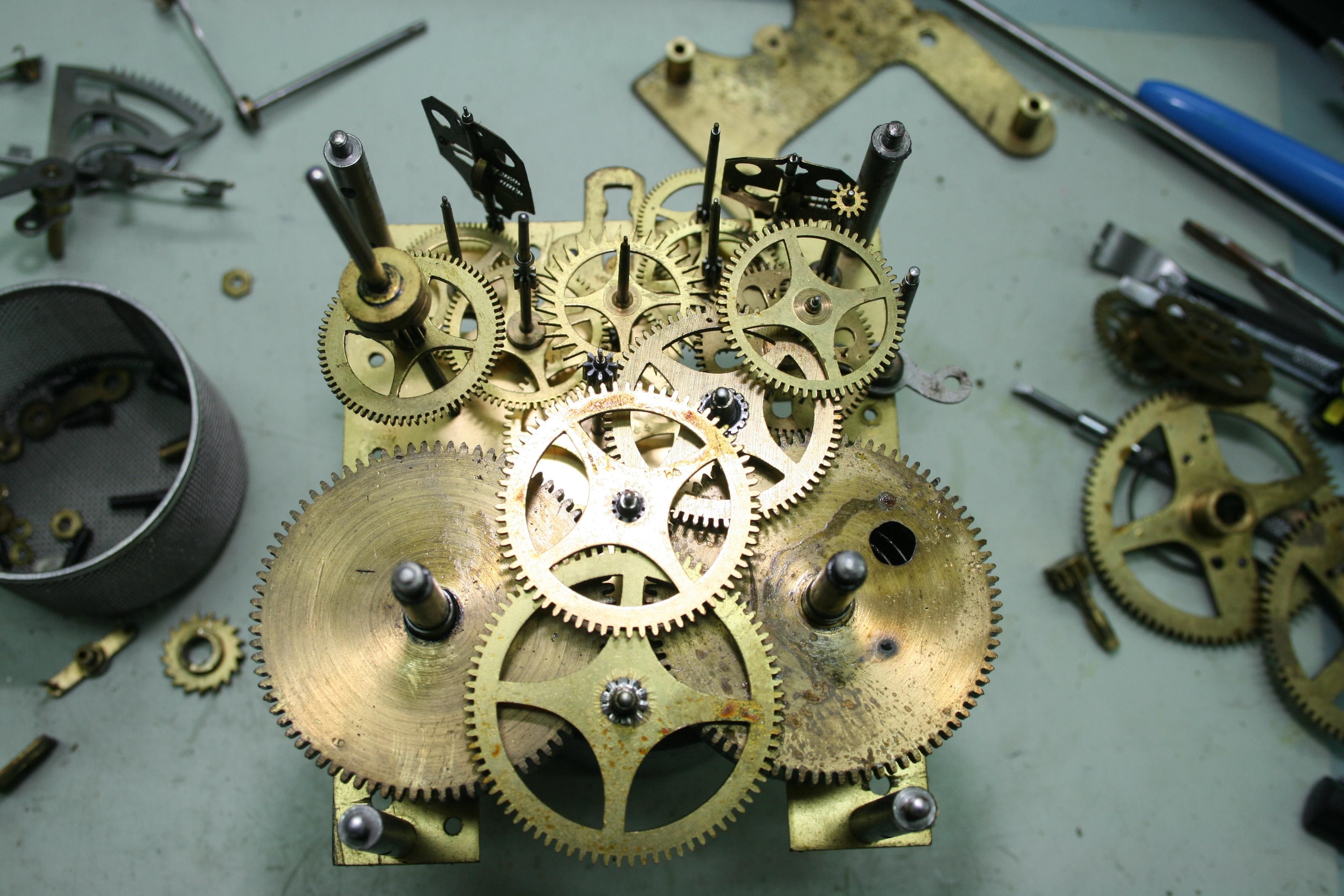 The inside of a German striking clock, at the bottom you can see a big wheel that's called the 8-day wheel. The next wheel is that the centre wheel, the wheels are brass and mounted on steel Arbors and pinions.