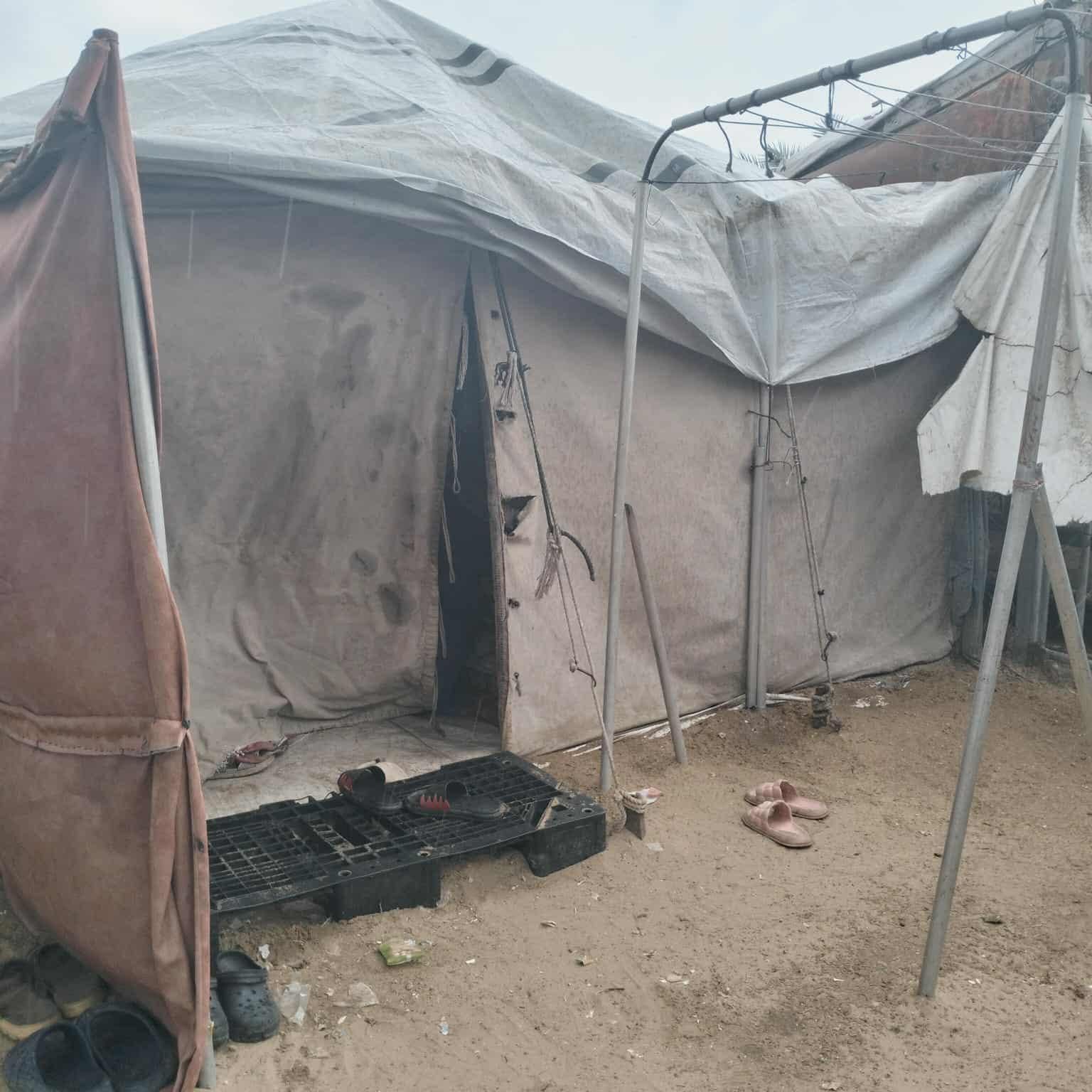 Picture of the tent, from outside. It was last week when there was a storm. We can see that the fabrics is dilapidated.