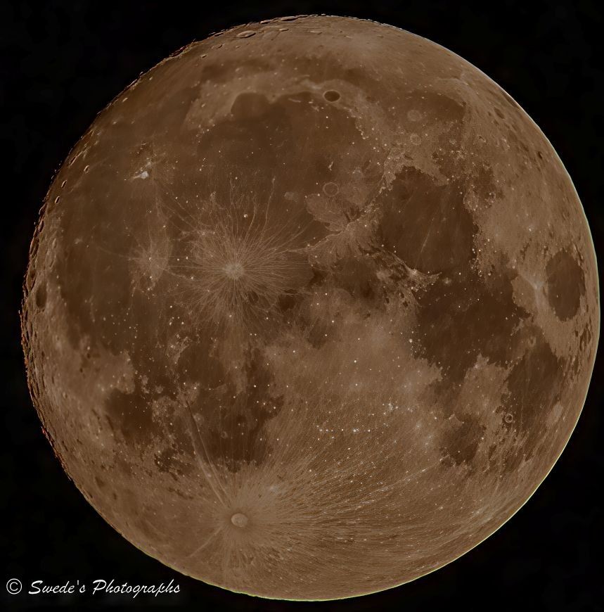 "The Moon fills the frame like a celestial monument—silent, ancient, and intricately scarred. Its surface is a tapestry of craters, ridges, and plains, each etched by time and cosmic impact. Some craters are deep and shadowed, like sunken eyes in a weathered face, while others are shallow and wide, their rims softened by eons of dust and silence. The texture is rough and pitted, yet strangely elegant, like stone carved by invisible hands.

Light falls across the lunar surface at a gentle angle, casting long shadows that accentuate the terrain’s depth and drama. The highlands gleam faintly, while the darker maria—vast basaltic plains—stretch like ancient scars across the Moon’s face. There’s no color here, only shades of gray and silver, but the contrast is rich and expressive, revealing the Moon’s layered history.

The image feels both intimate and immense, as if the viewer is hovering just above this distant world, close enough to trace its contours with a fingertip. In the bottom left corner, the credit “Swede’s Photographs” is quietly inscribed, grounding this cosmic portrait in human artistry." - Copilot