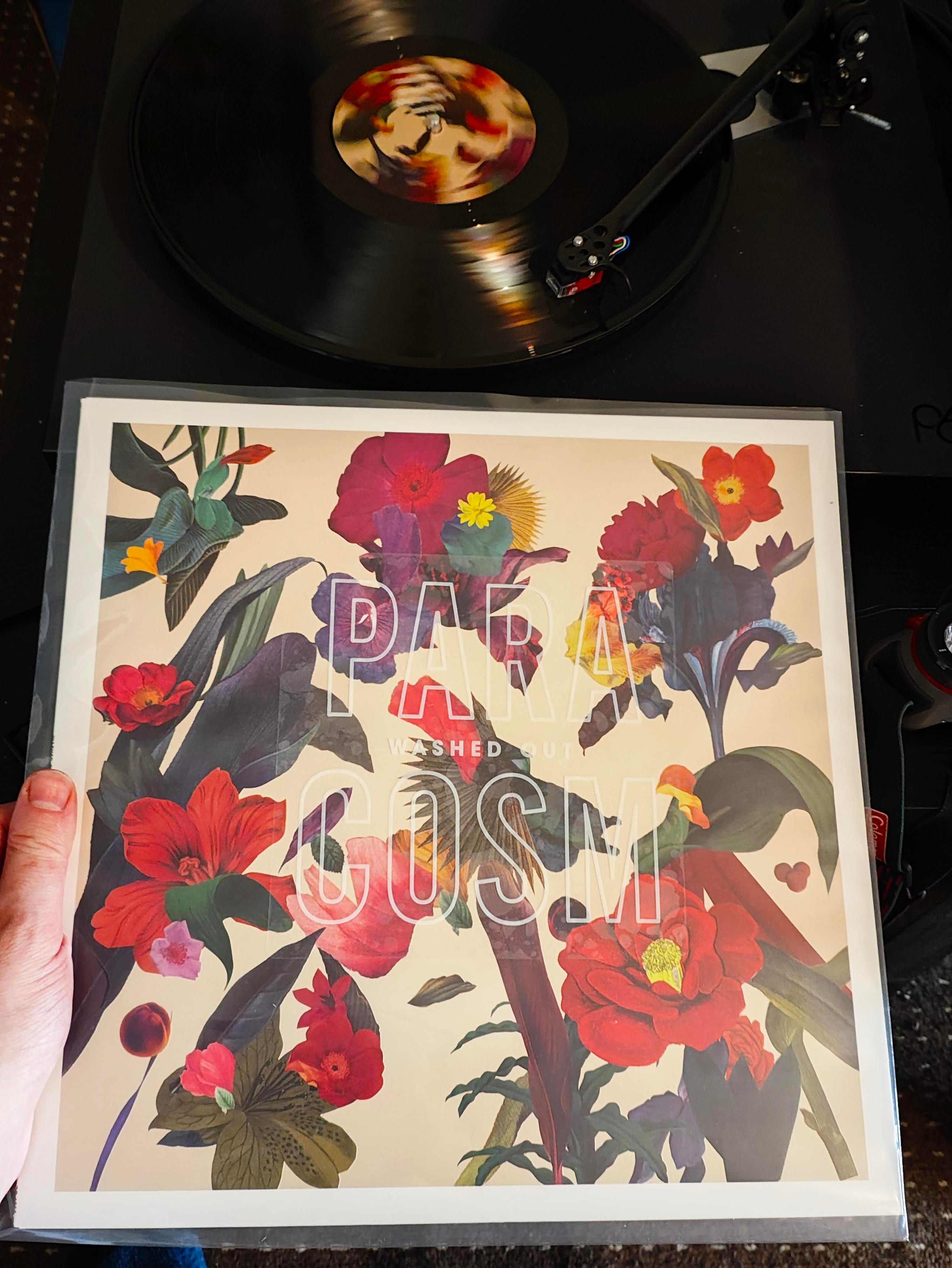 Red flowers cover with title on a sticker on the outer sleeve 