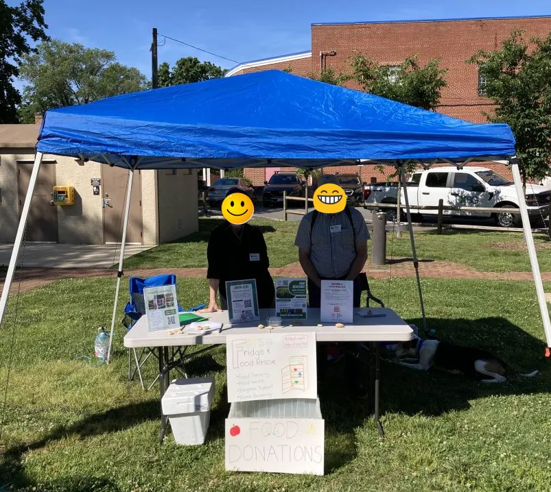 Two community members, master gardeners, man the booth.