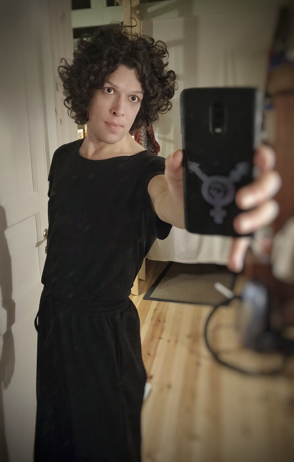 Mirror selfie, full body, I'm wearing black.