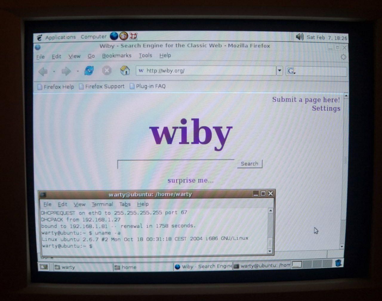 A photo of a CRT showing Ubuntu 4.10 running; wiby search engine is open in Mozilla Firefox 1.0