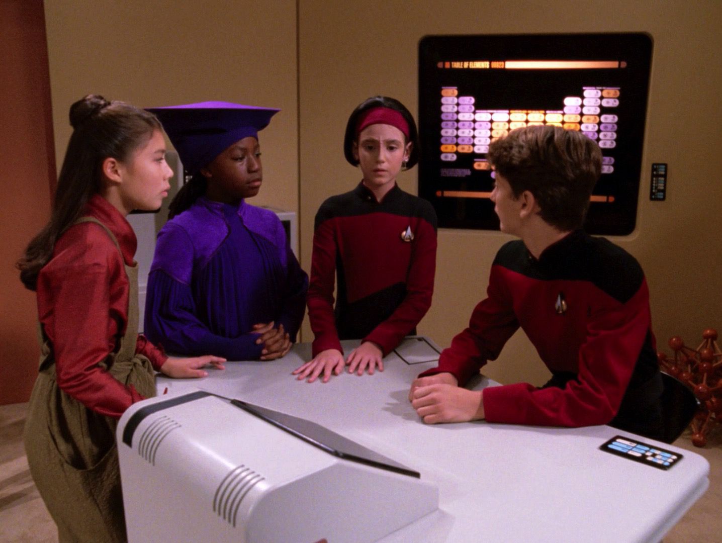 In a Next Generation episode ‘Rascals’, Captain Picard, Ensign Ro Laren, Guinan and Keiko O’Brien become children.  They are shown discussing their situation in the Sickbay.