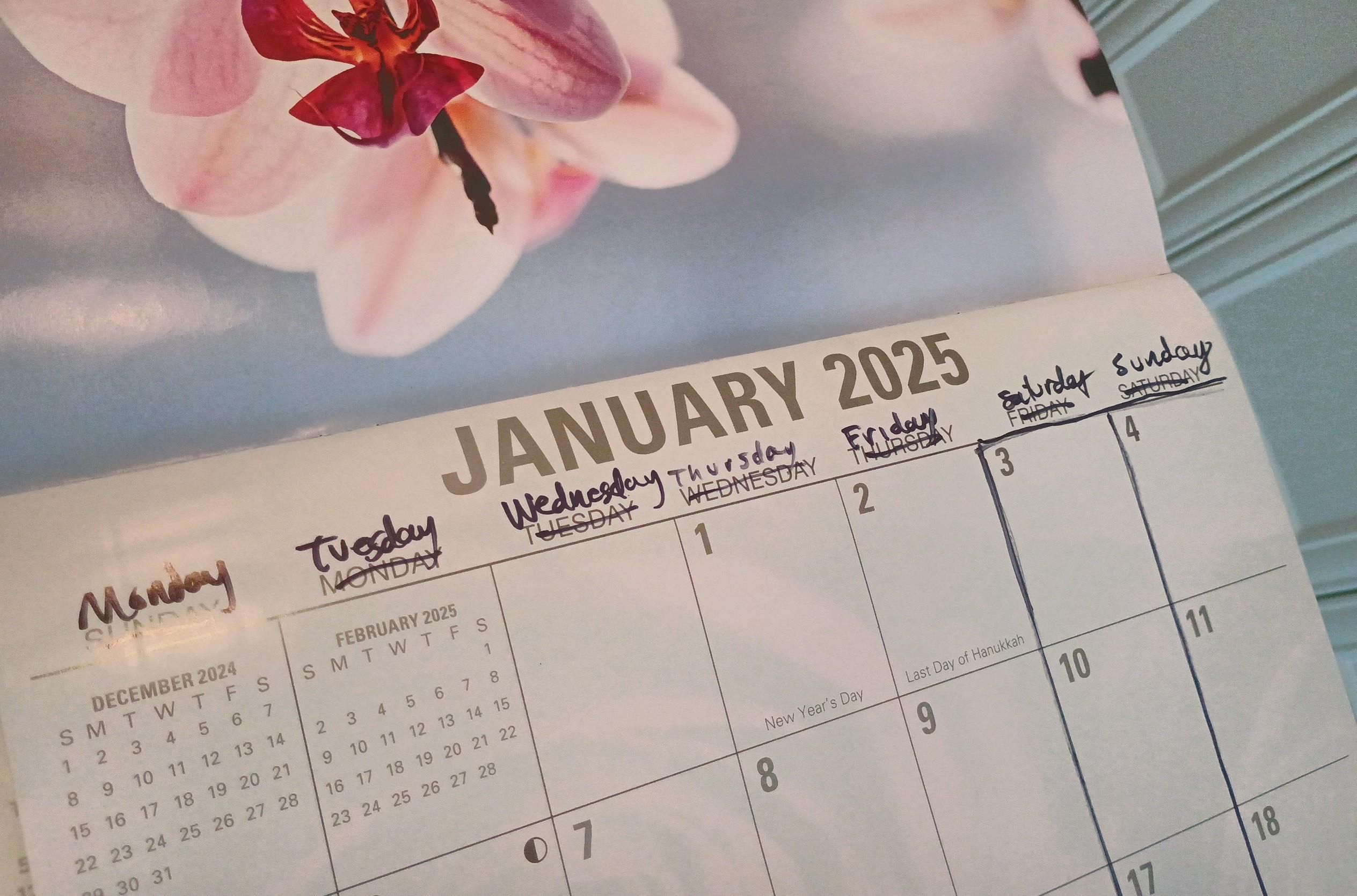 A wall calendar is shown and I've crossed out the days of the week and just written them back in, aligned with this year's day numbers. It shifted the week so that Saturday and Sunday are at the end of the week now.