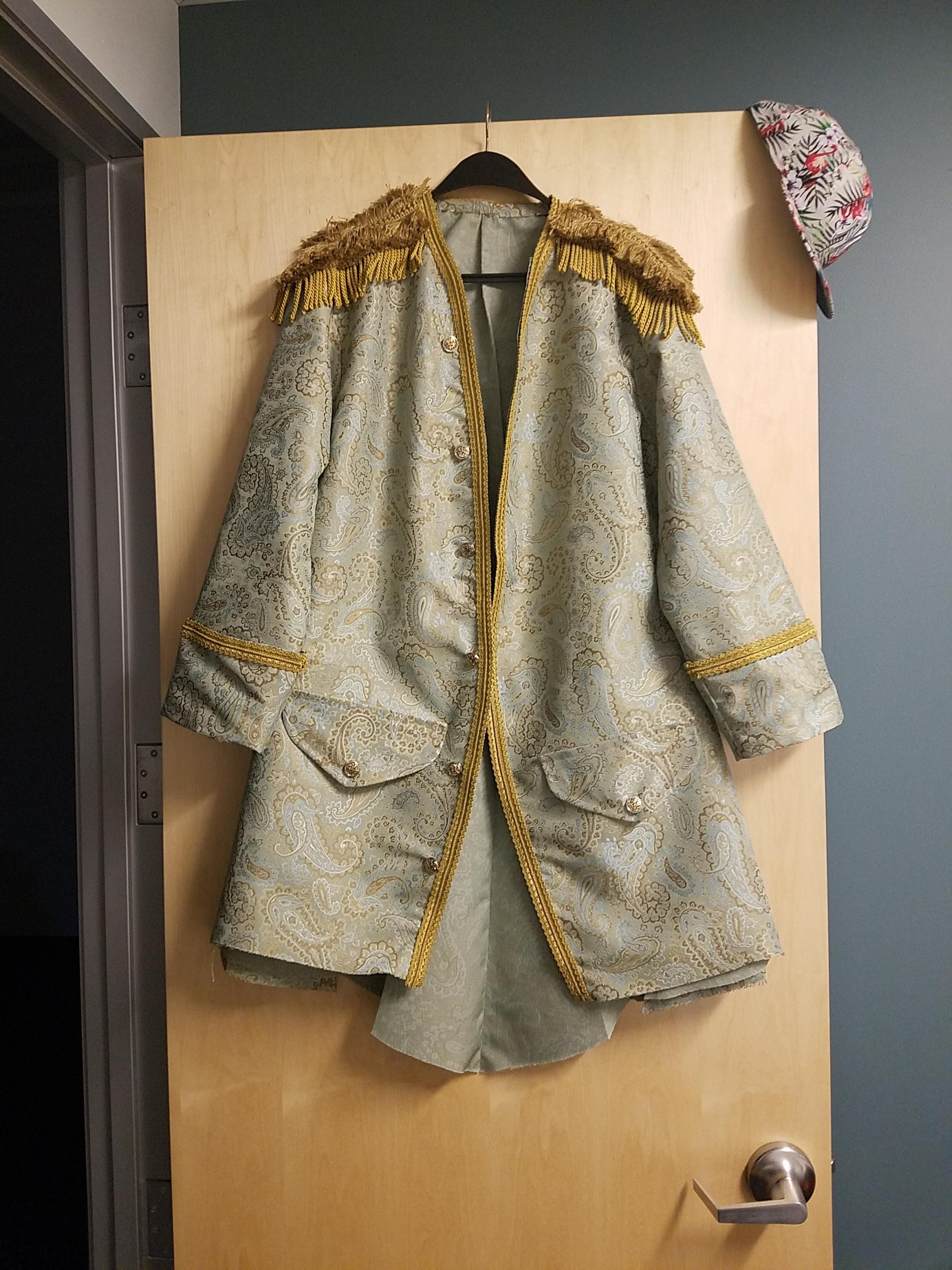 Full length photo of jacket with floral print fitted cap that I wore with it