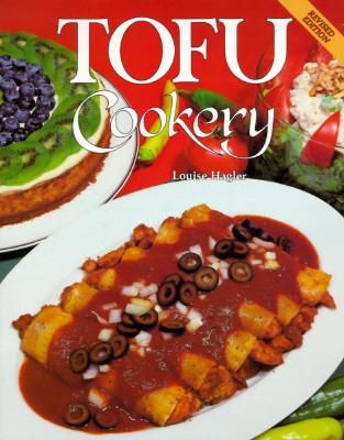 Cover of Tofu Cookery by Louise Hagler, showing a plate of enchiladas in red sauce, a tofu cheesecake with fresh fruit, and a bowl of tofu dip