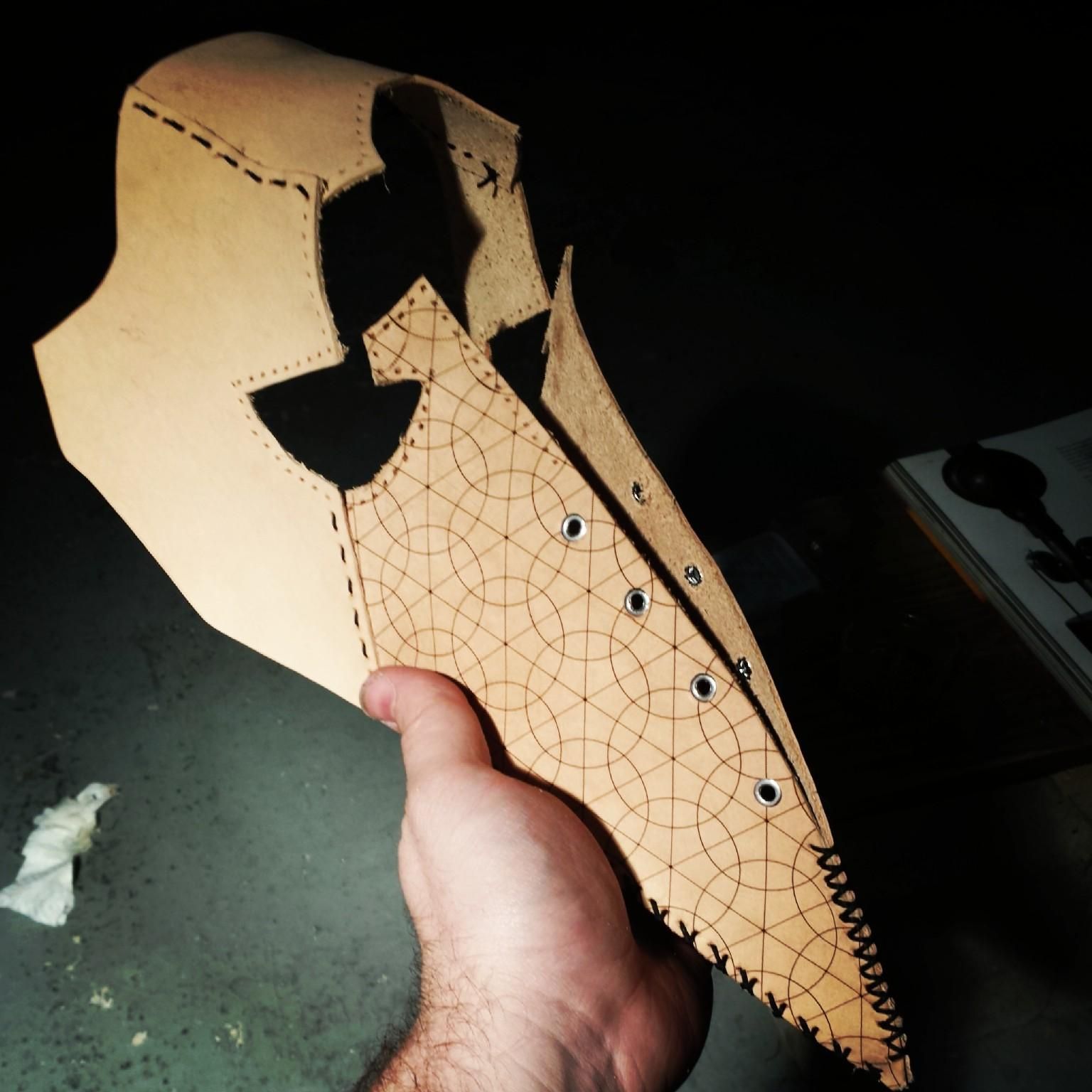 The plague mask before dyeing and final stitching. There is laser engraved detail on the beak.