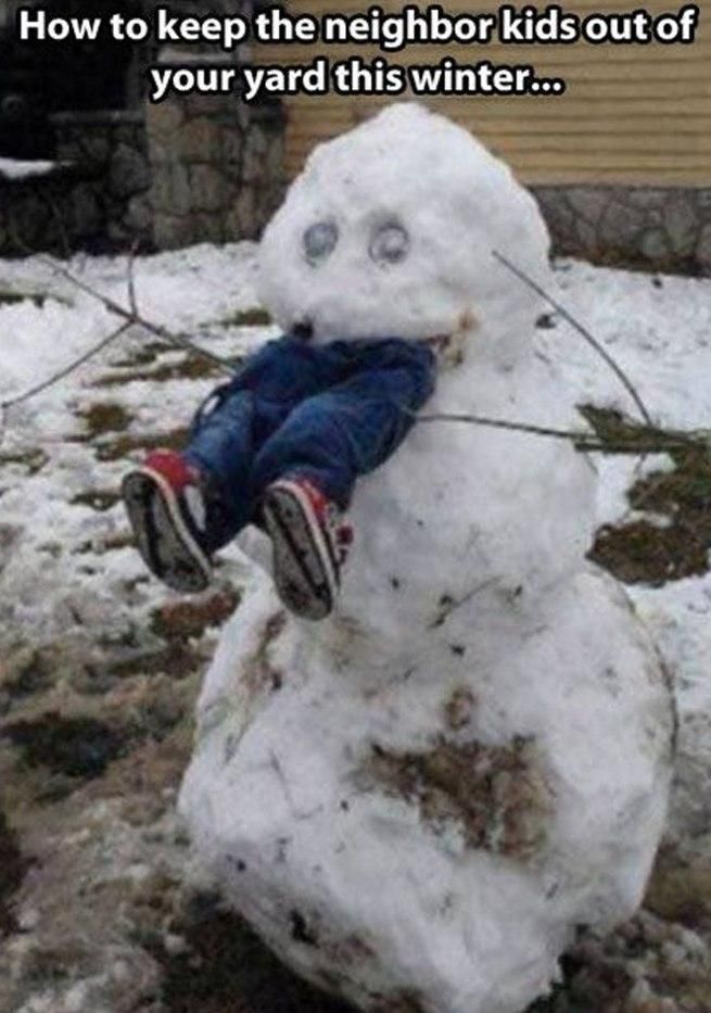 A dark-humor snow sculpture in a suburban yard shows a large, rough snowman holding what appear to be a pair of children’s legs sticking out of its mouth, creating the illusion that the snowman has eaten a child. The legs wear blue jeans and red-and-black sneakers, with twig arms extending from the snowman’s sides. Patchy snow covers the ground, with a house wall visible in the background. White text at the top reads, “How to keep the neighbor kids out of your yard this winter…”, turning the scene into a provocative visual joke.