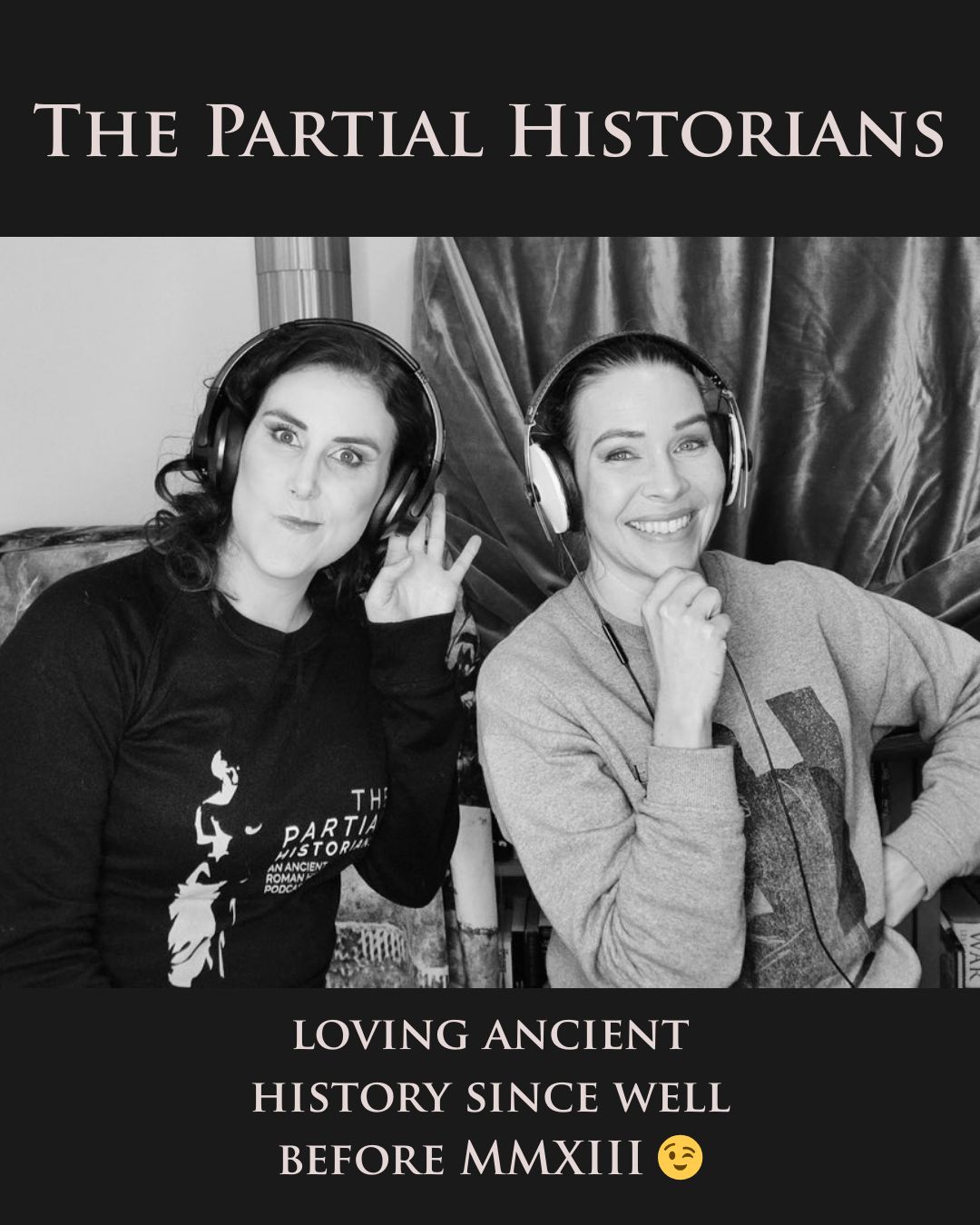 Dr Rad and Dr G smiling and making funny faces while wearing headphones. Text above and below photo reads, “The Partial Historians, loving ancient history since well before MMXIII’.