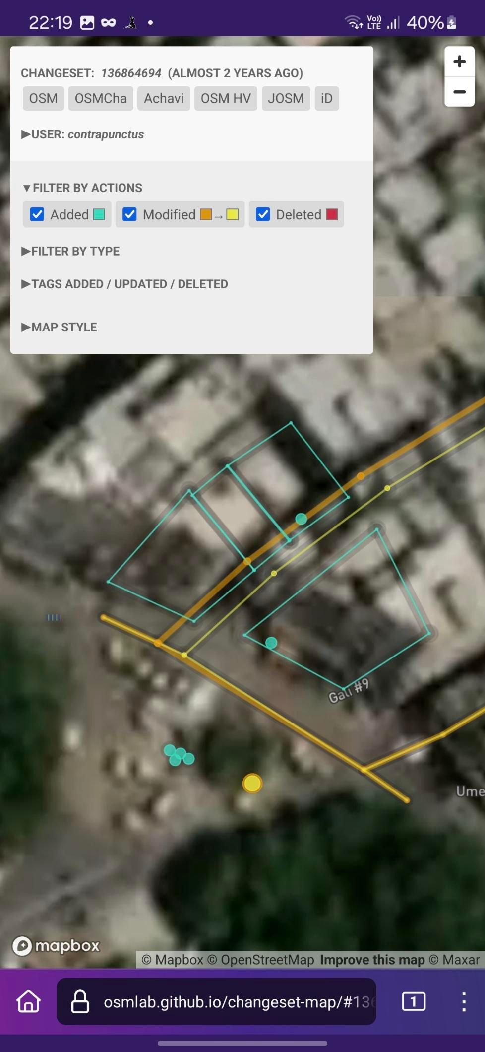Screenshot of Changeset Map, visualizing the changes made against a satellite imagery background. I've added 4 apartment buildings (represented by blue polygons), in addition to tweaking some streets, and adding 4 surveillance cameras, 2 POIs, and an alternative name for Mohammadi Chowk.