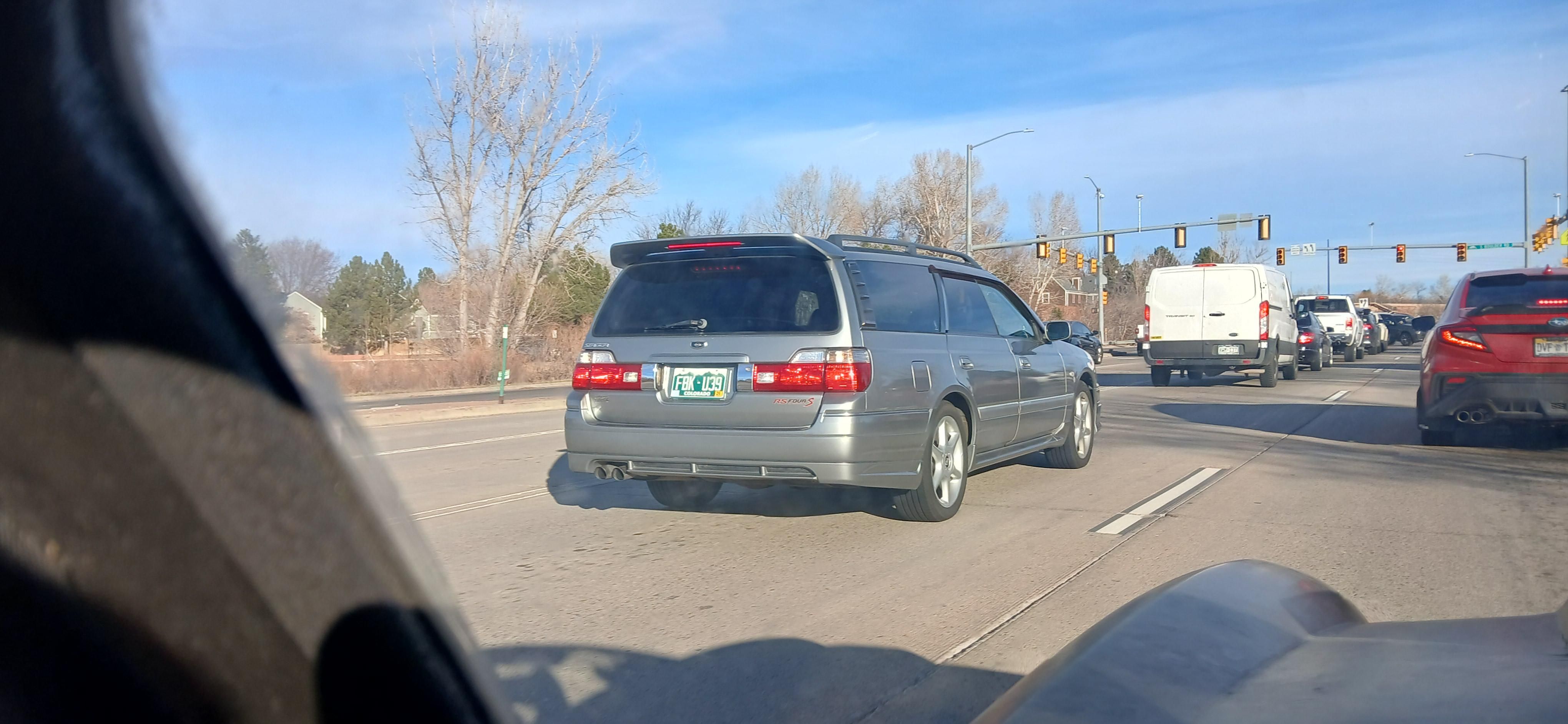 Long silver wagon with a prominent roof lip