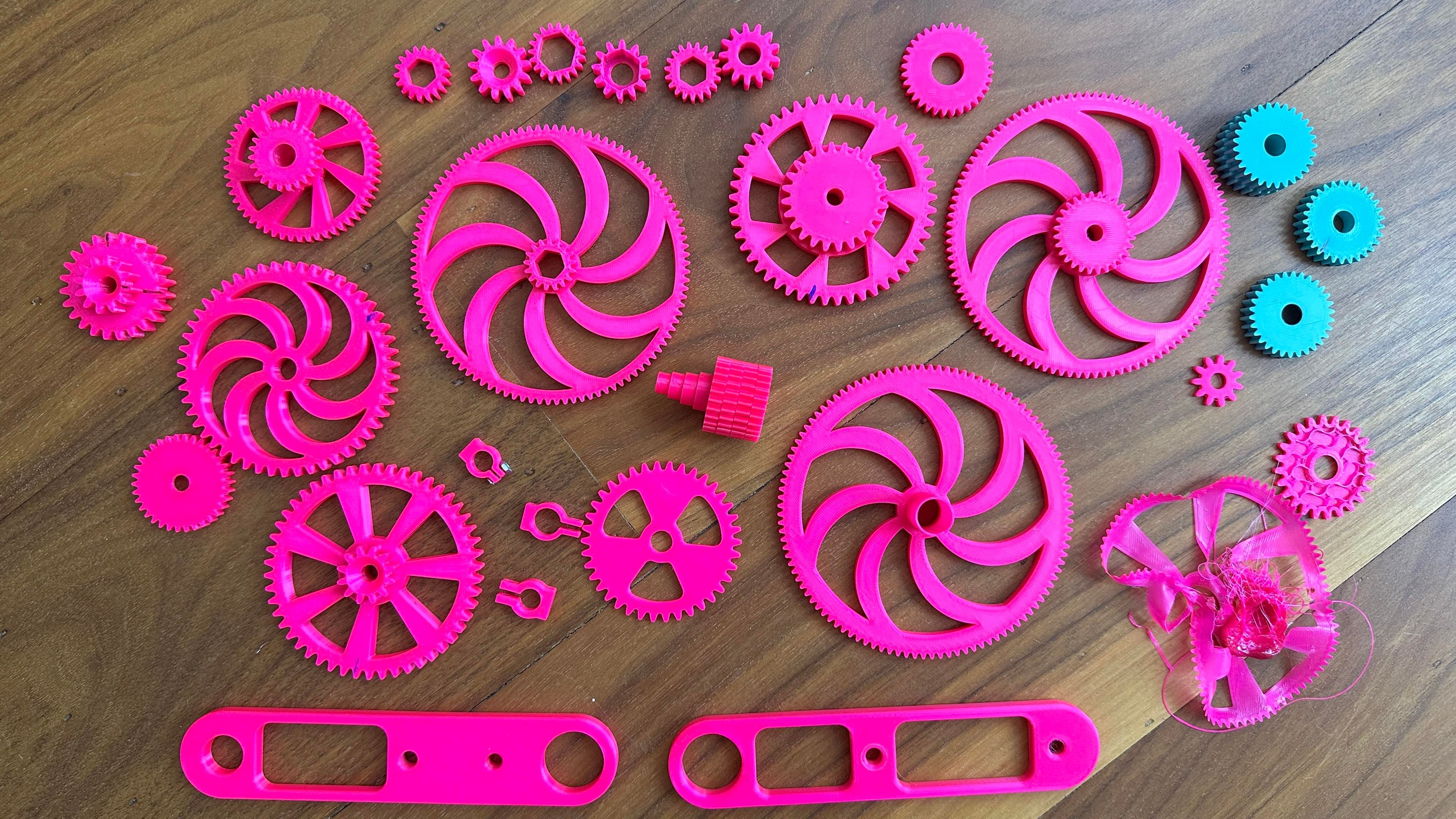 Array of gears and brackets printed during prototyping. 