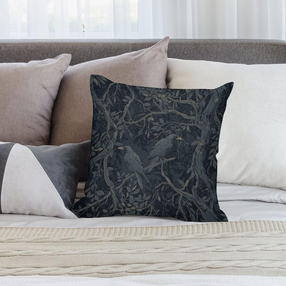 A Black pillow with two crows on it.