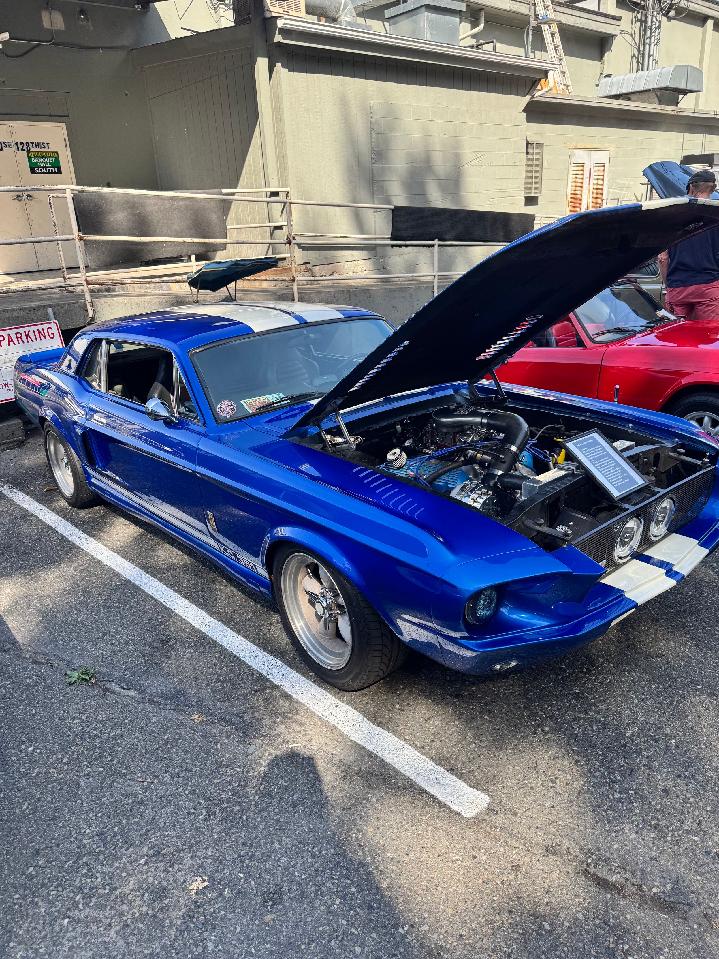 Blue late 60s Mustang, restored Cobra build.