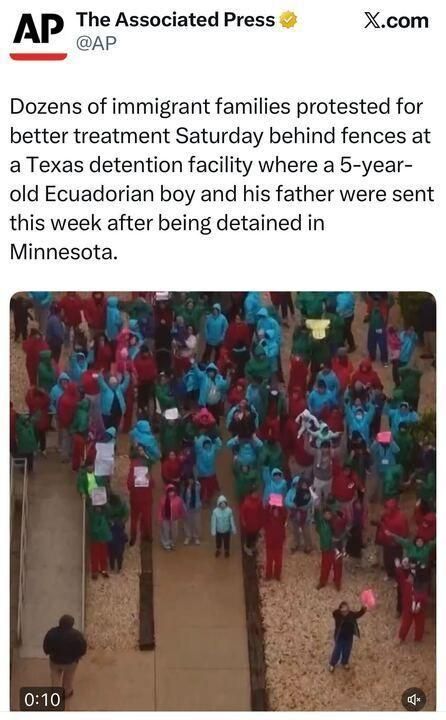 Screenshot of an X.com post by The Associated Press (@AP) stating that dozens of immigrant families protested for better treatment behind fences at a Texas detention facility, where a 5-year-old Ecuadorian boy and his father were sent after being detained in Minnesota. Below is a video thumbnail showing a crowd gathered outdoors along a fenced walkway; many people wear bright blue or red outerwear, and some hold signs.