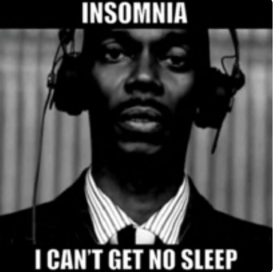 A black man wearing recording studio headphones. 
INSOMNIA - I Can't get no sleep