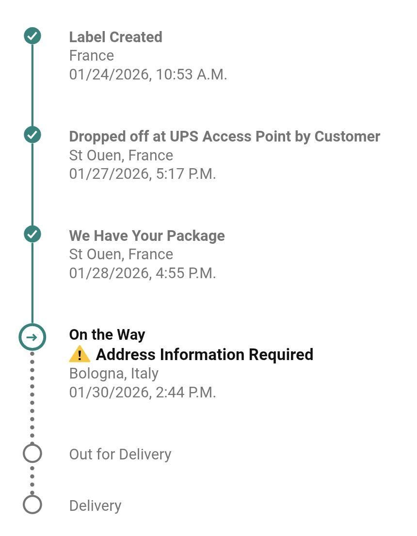 Photo of an UPS tracking page showing an exception: "Address information Required".