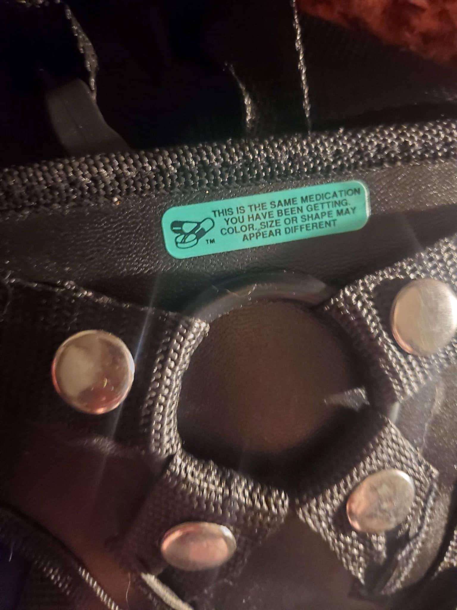 Strap harness with a sticker applied:
"This is the same medication you have been getting. Color, size, or shape may appear different."
