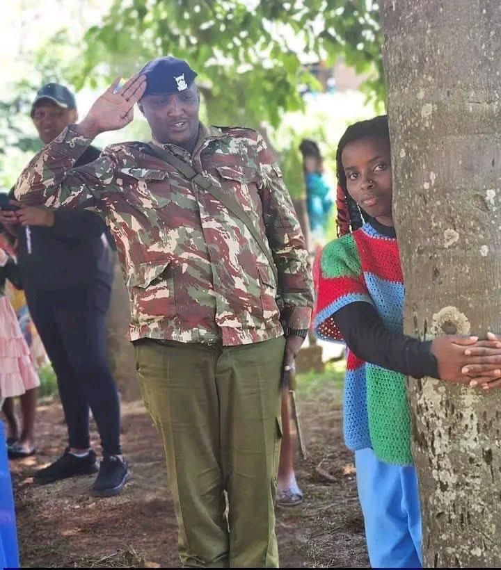 Truphena Muthoni holding an indigenous tree for 72 hours. 