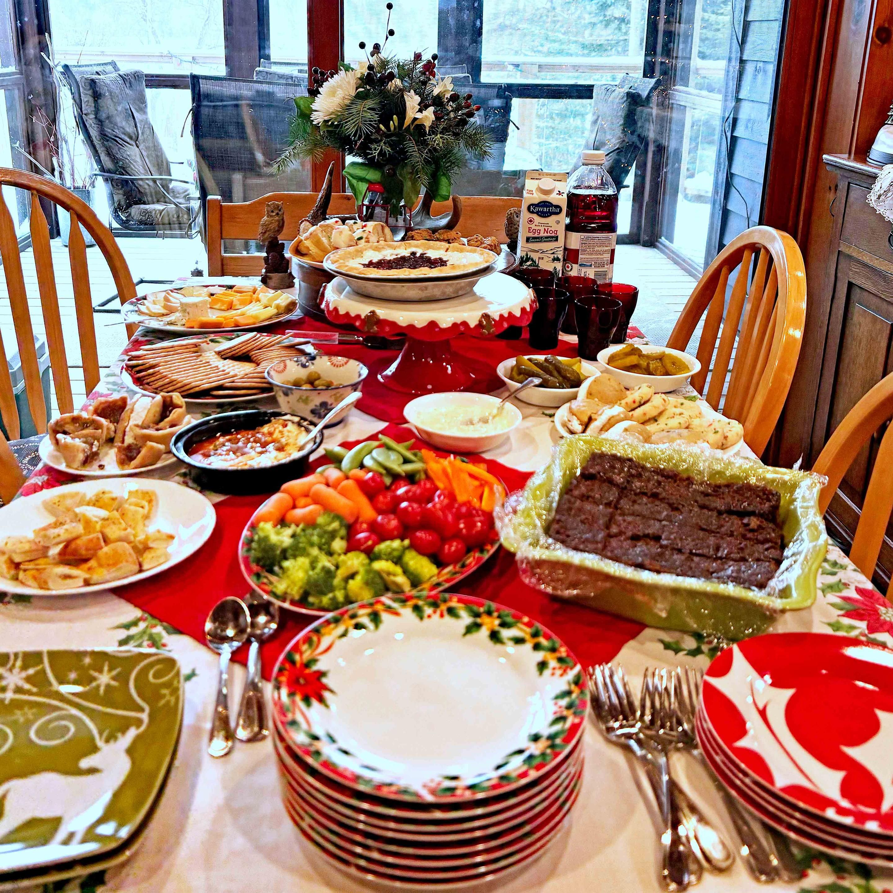 Pot luck goodies brought for the party. That green ceramic dish to the right is my vegan cake of sadness. It was a hit. 

Through the window we can see a wintery Sunfish Lake. Edna lived next door.