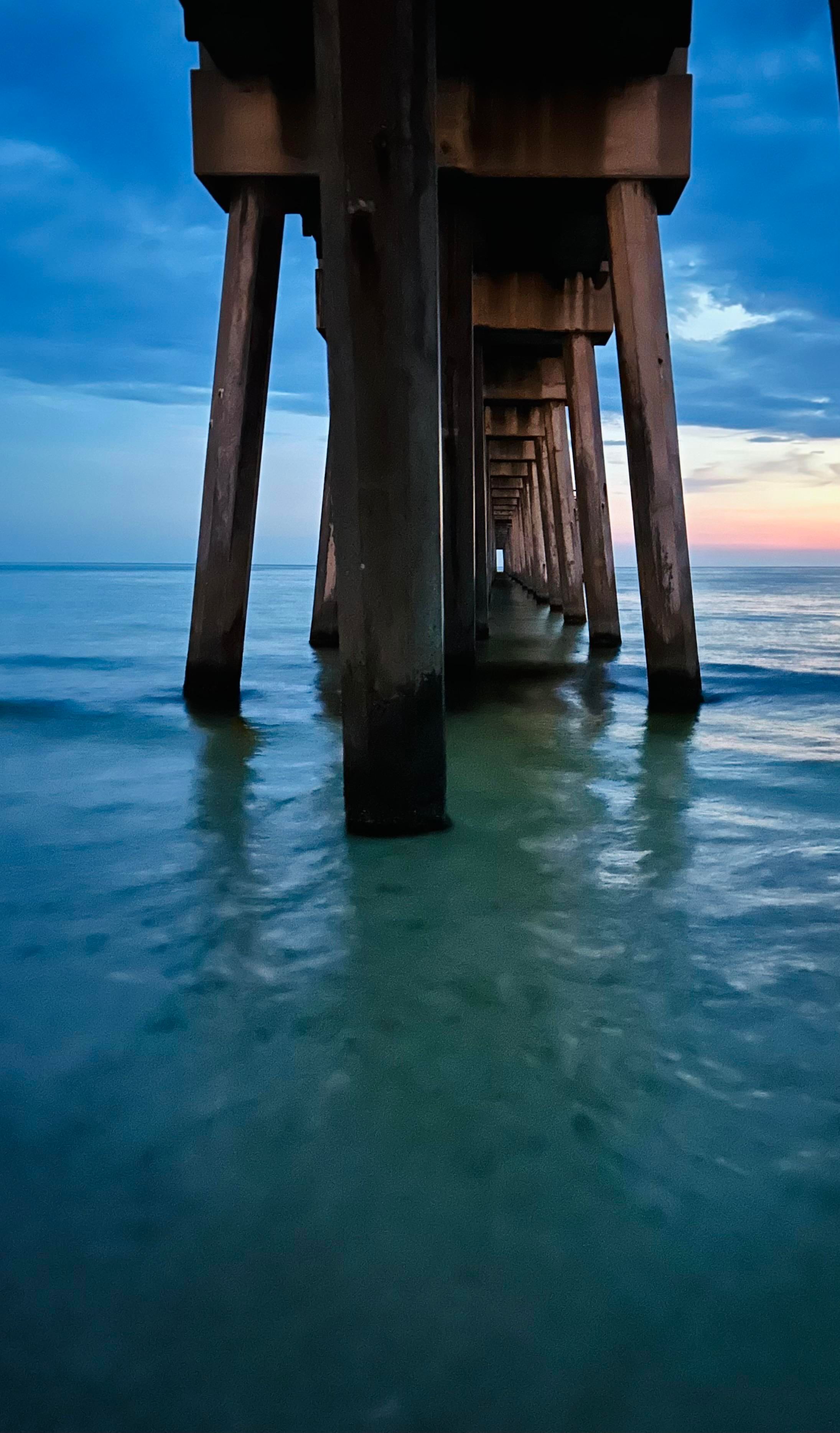 Sunset under the pier at PCB, FL.