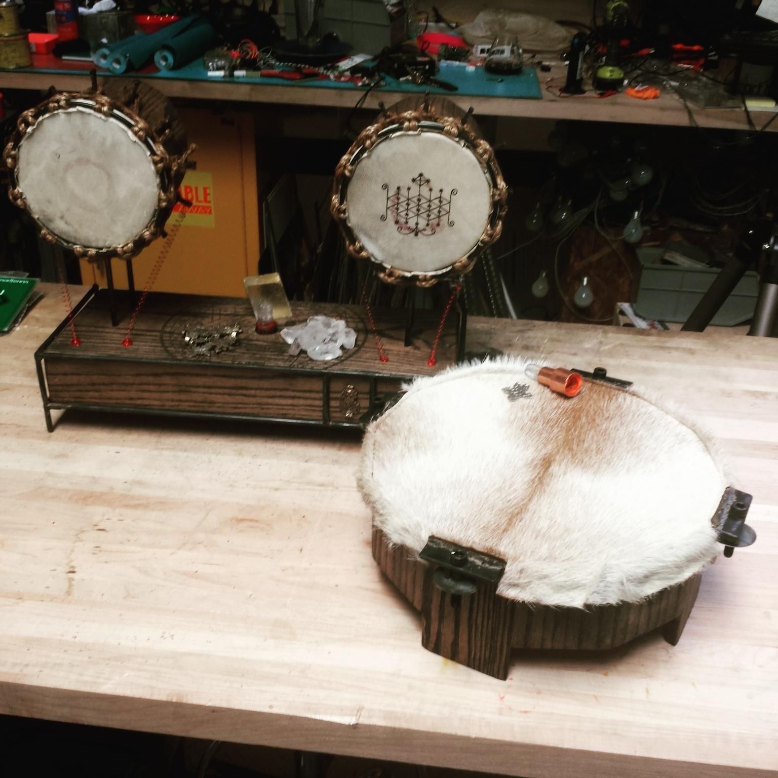 A set of speakers made from goatskin and oak with blued steel hardware.