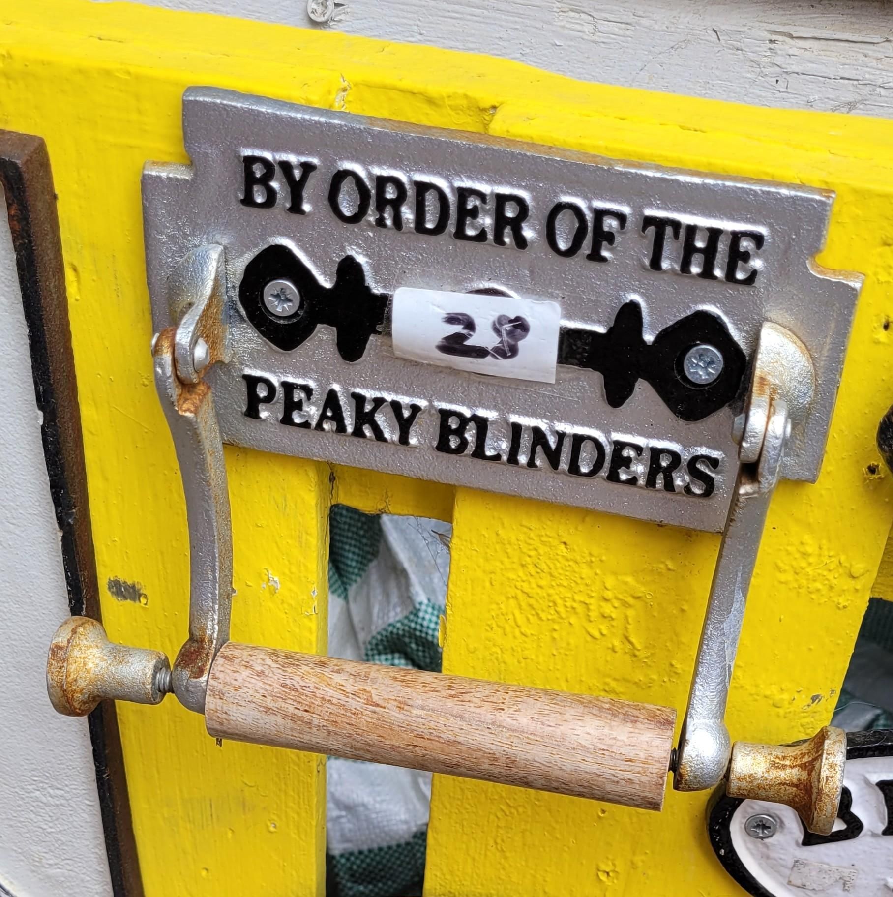A rubbish toilet roll holder that reads BY ORDER OF THE PEAKY BLINDERS

They're watching you on the loo